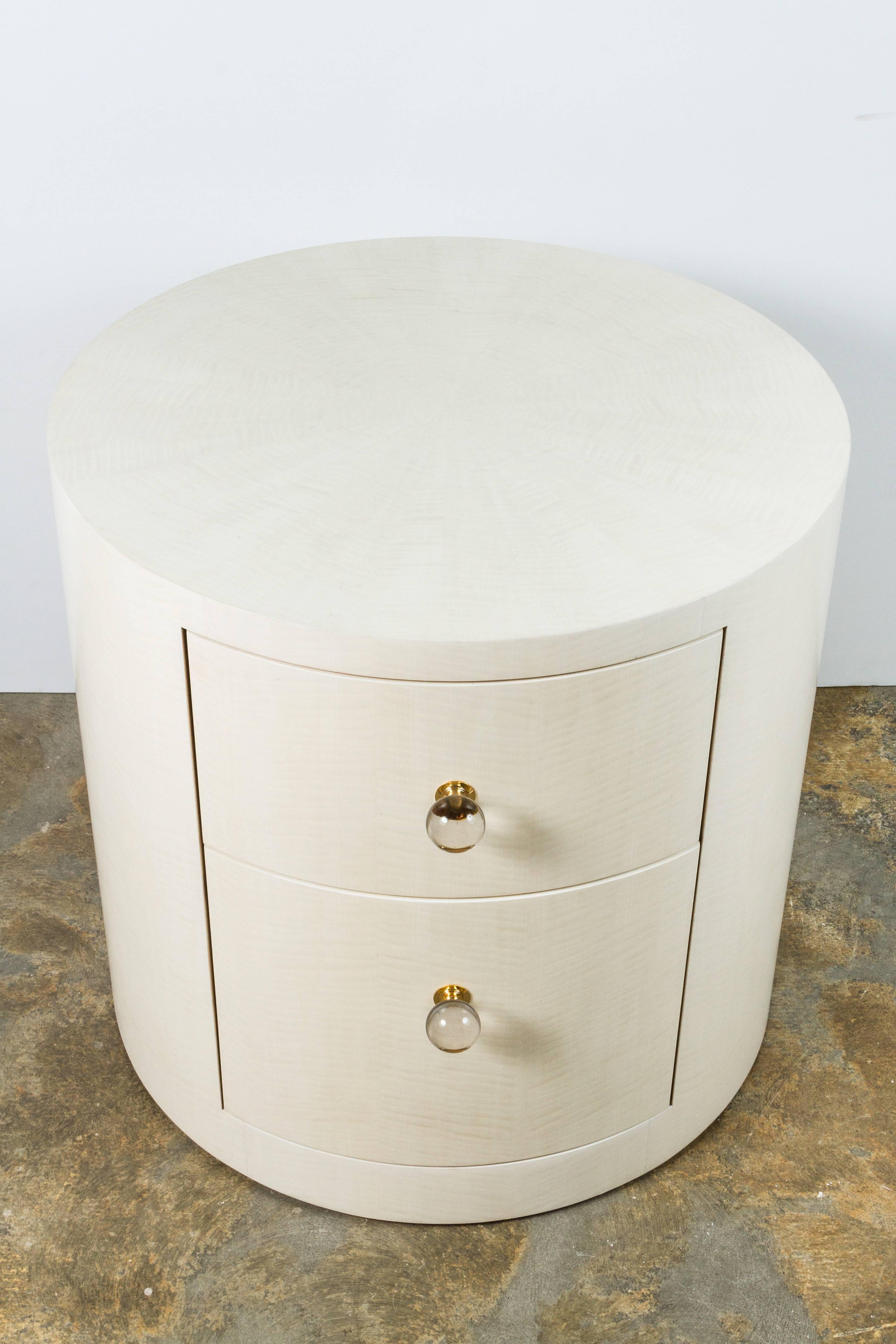 Paul Marra Italian-inspired 1970s style contemporary round nightstand or side table. Bleached maple,  starburst inlay, (shown with vintage crystal gold-plated knobs that are no longer available). By order. Price quoted is per each.  If specifying a