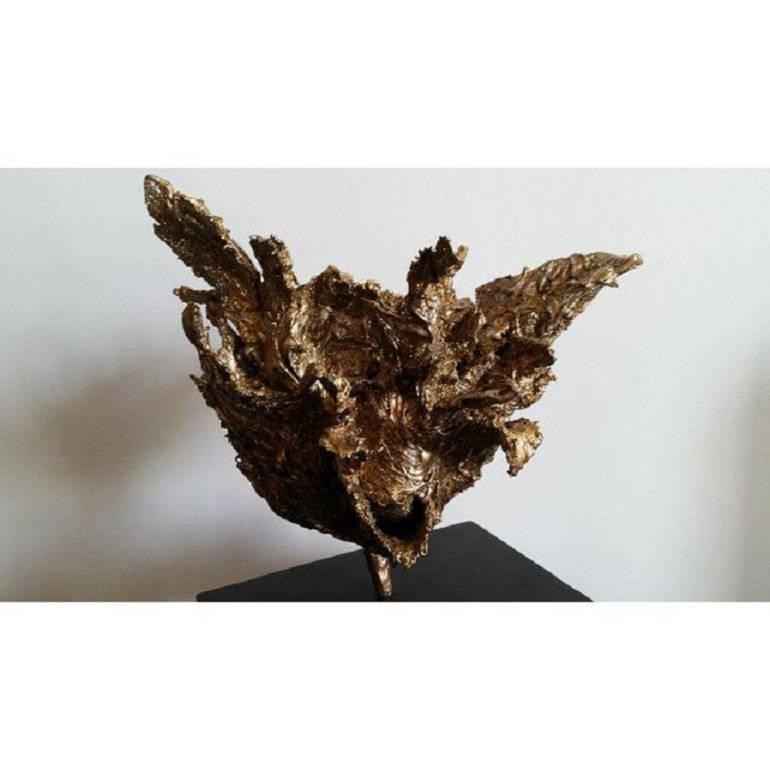 Abstract botanical sculpture in gold leaf finish. Wood base.