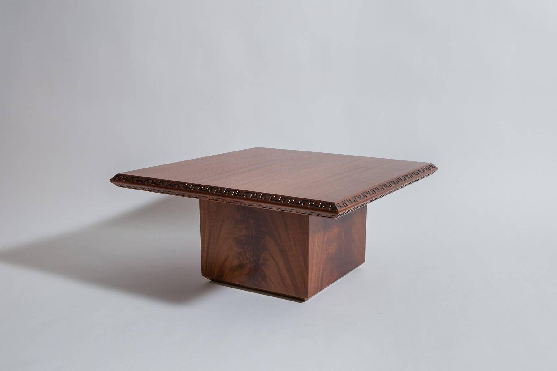 Mahogany side table designed by Frank Lloyd Wright and manufactured by Heritage Henredon Furniture. Taliesin edging to perimeter. Pair of sofas from this collection also available separately.