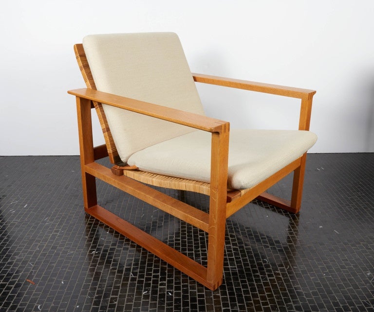 Pair of Borge Mogensen lounge chairs with cane and linen seats on oak frames-1958, Model 2254, mfg. Frederecia.