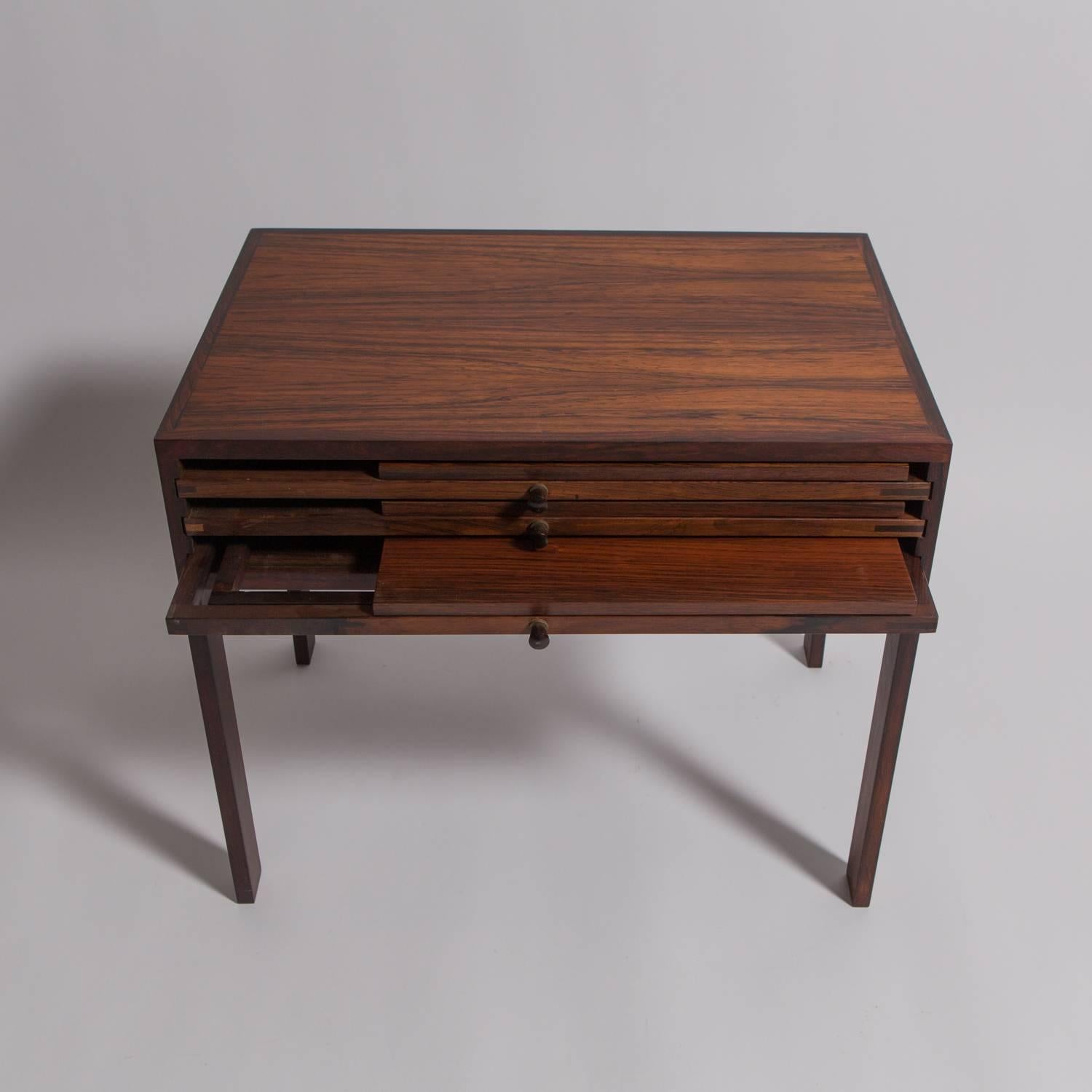 Illum Wikkelsø (1919–1999); Silkeborg; set of three folding tables stored inside table, Denmark, 1960s. Rosewood, brass metal manufacturer label.