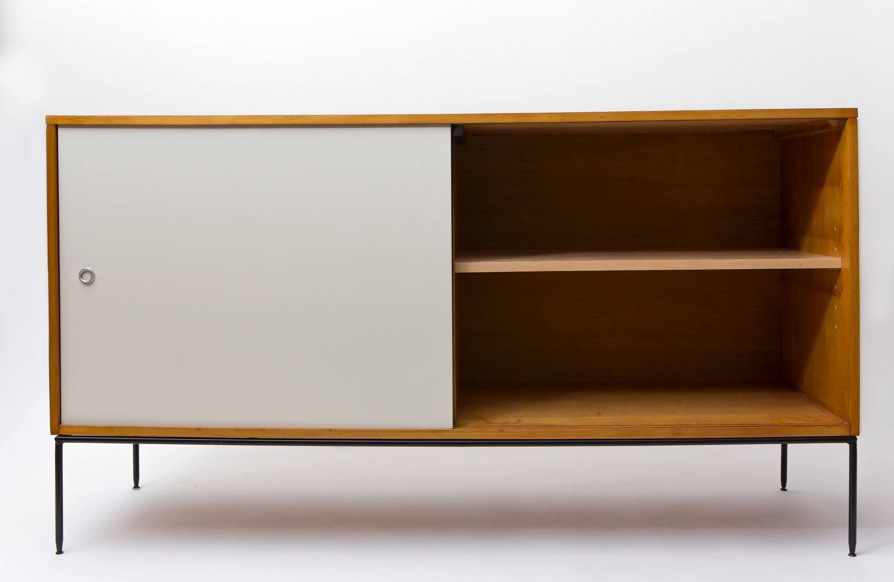Paul McCobb solid maple sideboard with iron base and black/white Masonite doors, 1950s. Planner Group.