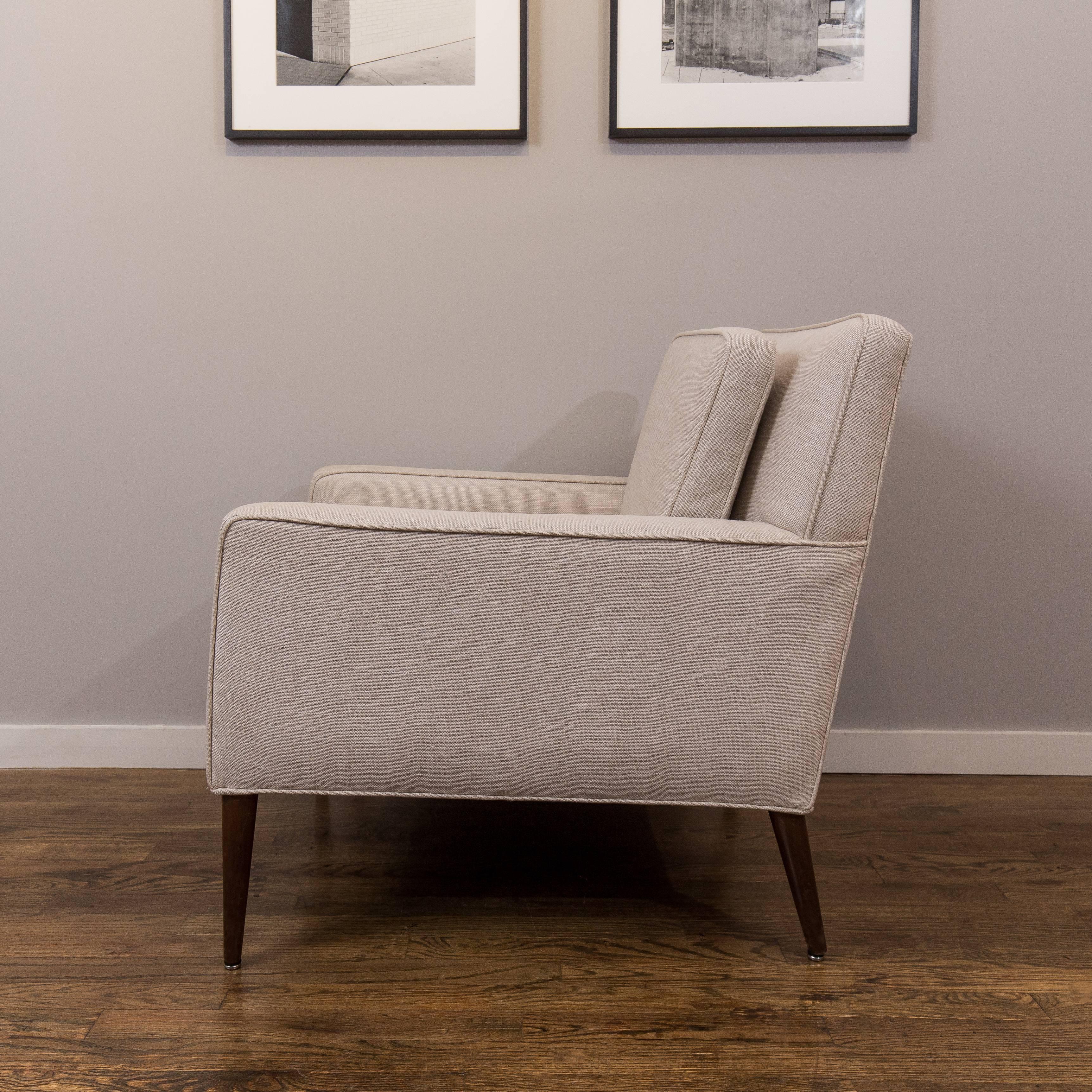 Paul McCobb single lounge chair and reupholstered in light grey linen.