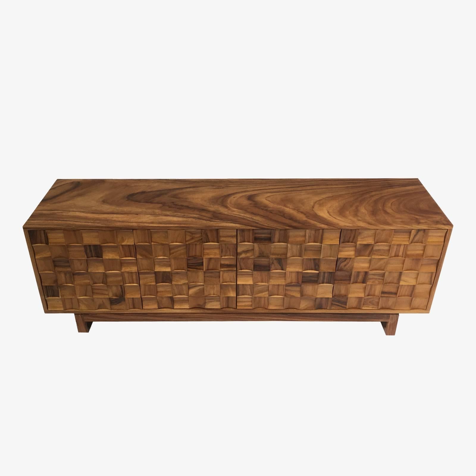 This credenza is designed and hand built in San Jose, Costa Rica. Dimay Valenzuela and Esteban Cardona are the husband and wife team behind A & O, a twenty year old custom wood working studio. This credenza is made from solid guanacaste, which is a