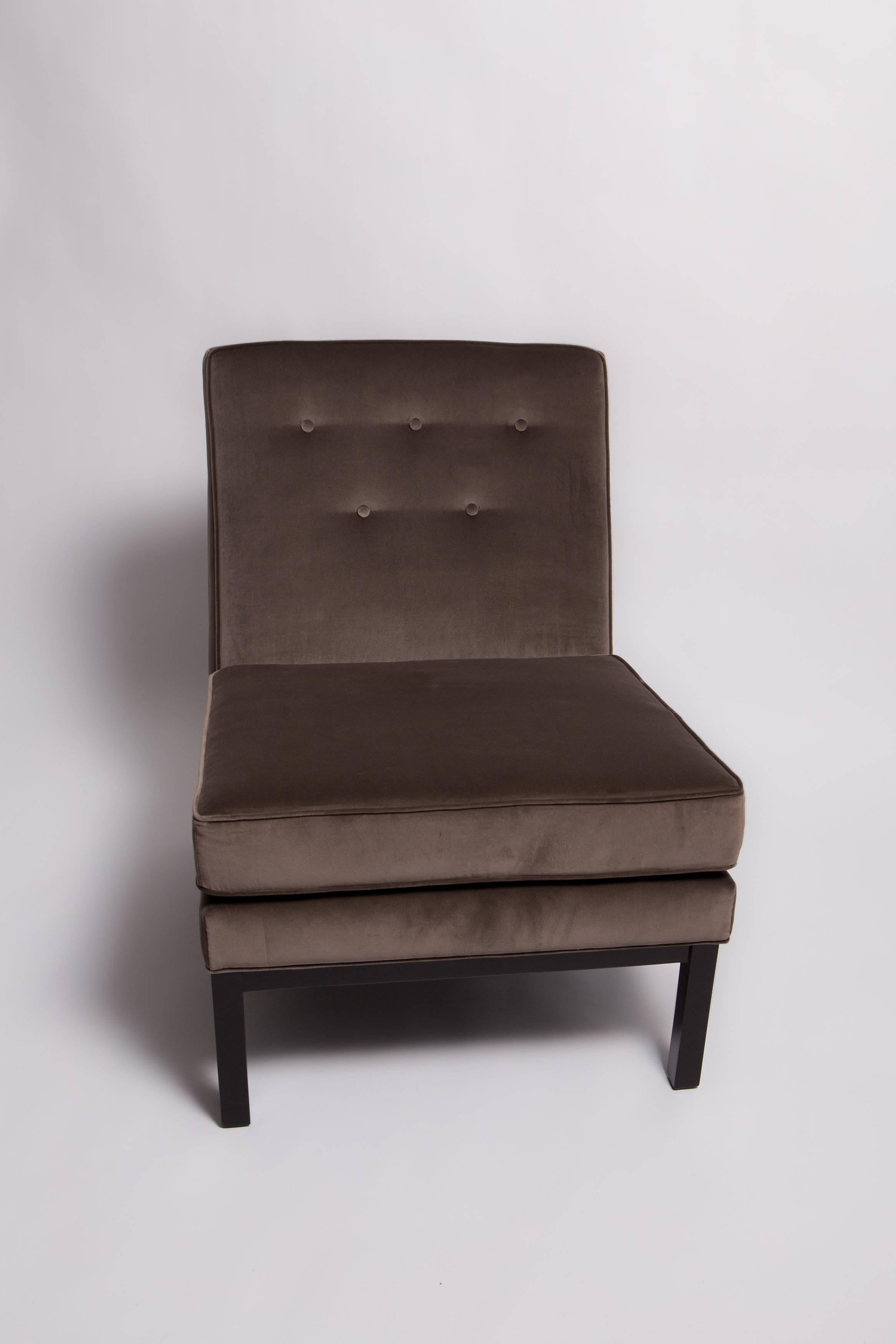 1950s lounge chair and ottoman, reupholstered in a plush gray velvet.