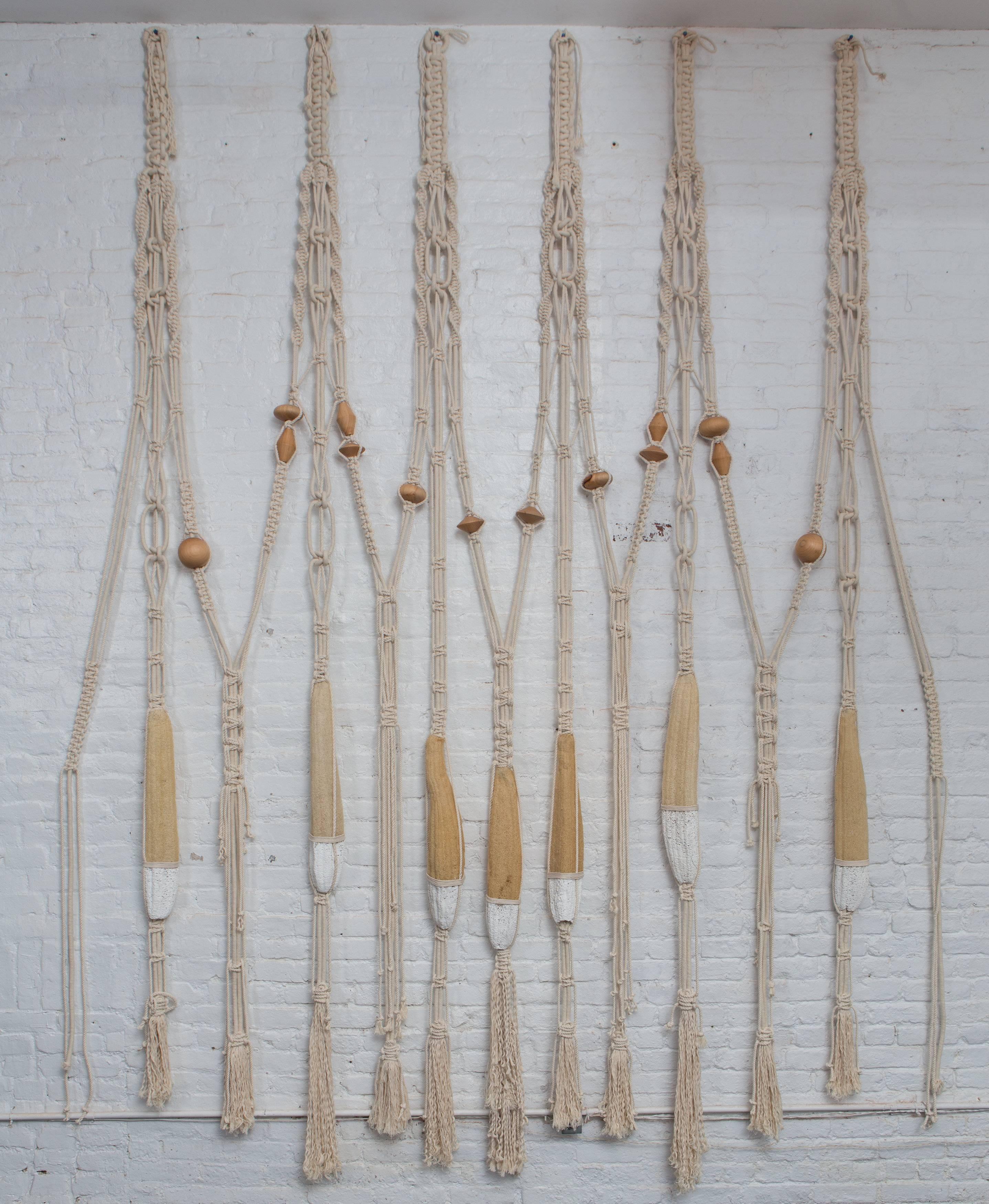 Hand braided macrame wall hanging with handmade teak beads by Oscar Ruiz Schmidt and Barbara Cuevas for Valenzuela. These two creatives, who co-own a fashion company in Costa Rica, produced this wall hanging for a show at reGeneration entitled, Two