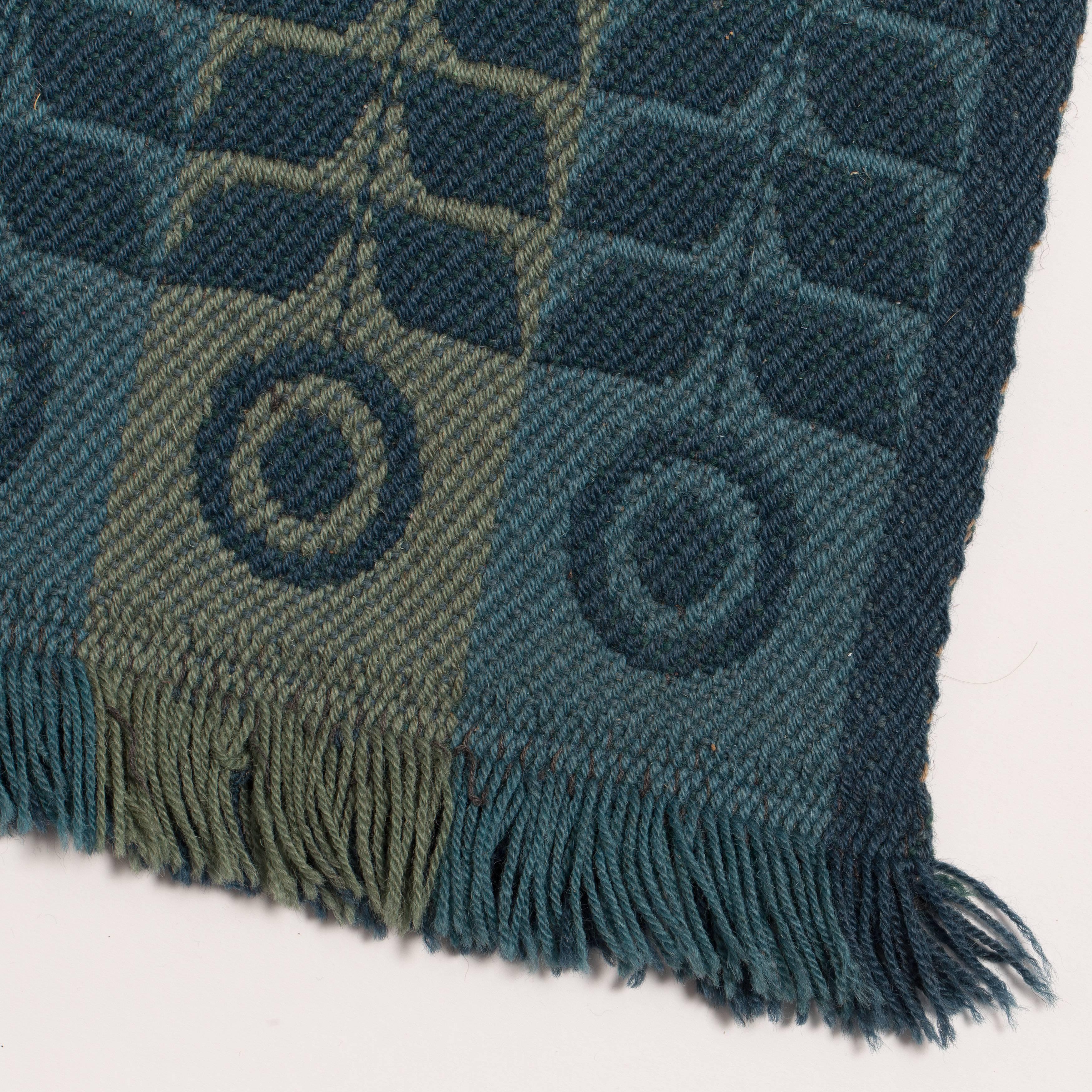 Flatweave Scandinavian rug with intricate pattern.