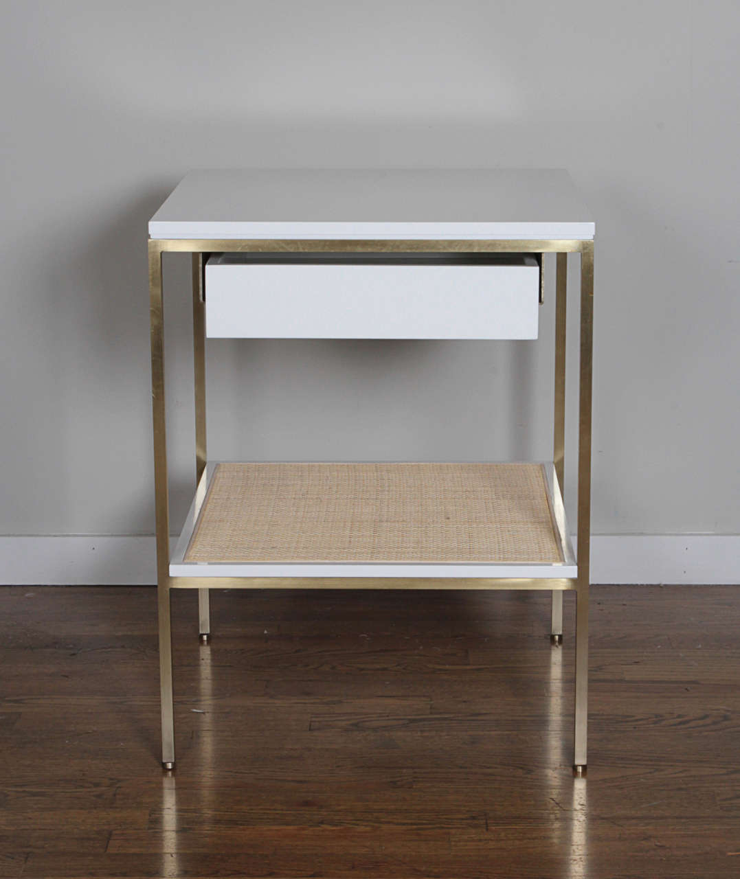 Re: 392 Bedside Table in Serpentine Green on Satin Brass frame with Caned shelf In Excellent Condition In New York, NY