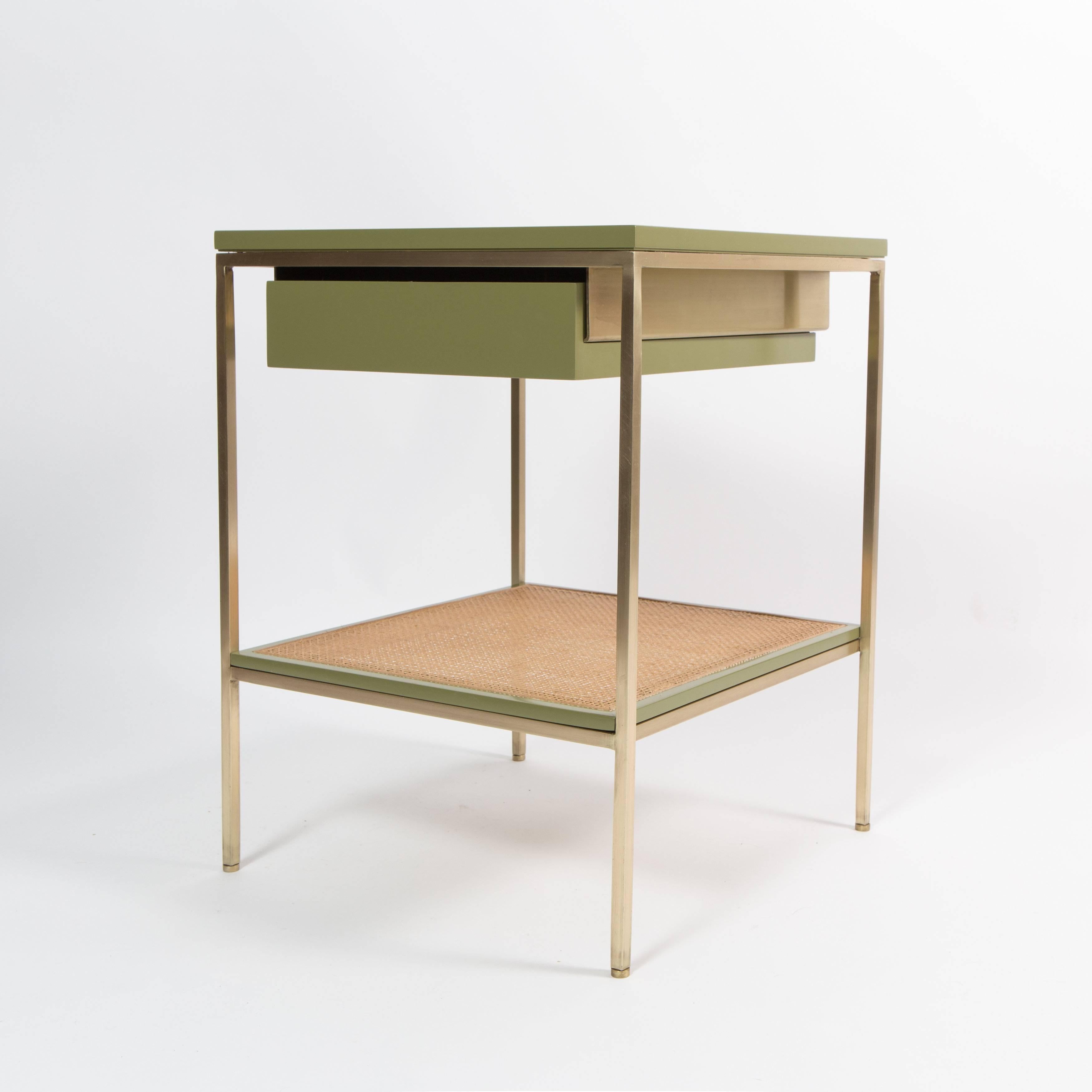 Versatile, minimalist style bedside tables with lacquered components on satin brass frames.  Available in custom colors for a 10% up-charge. Solid or caned shelf options.  Currently in stock in this color combination.
