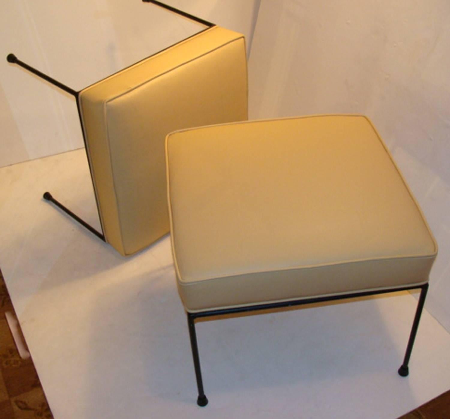 Nice pair of vintage Paul McCobb iron leg stools and newly recovered in leather.