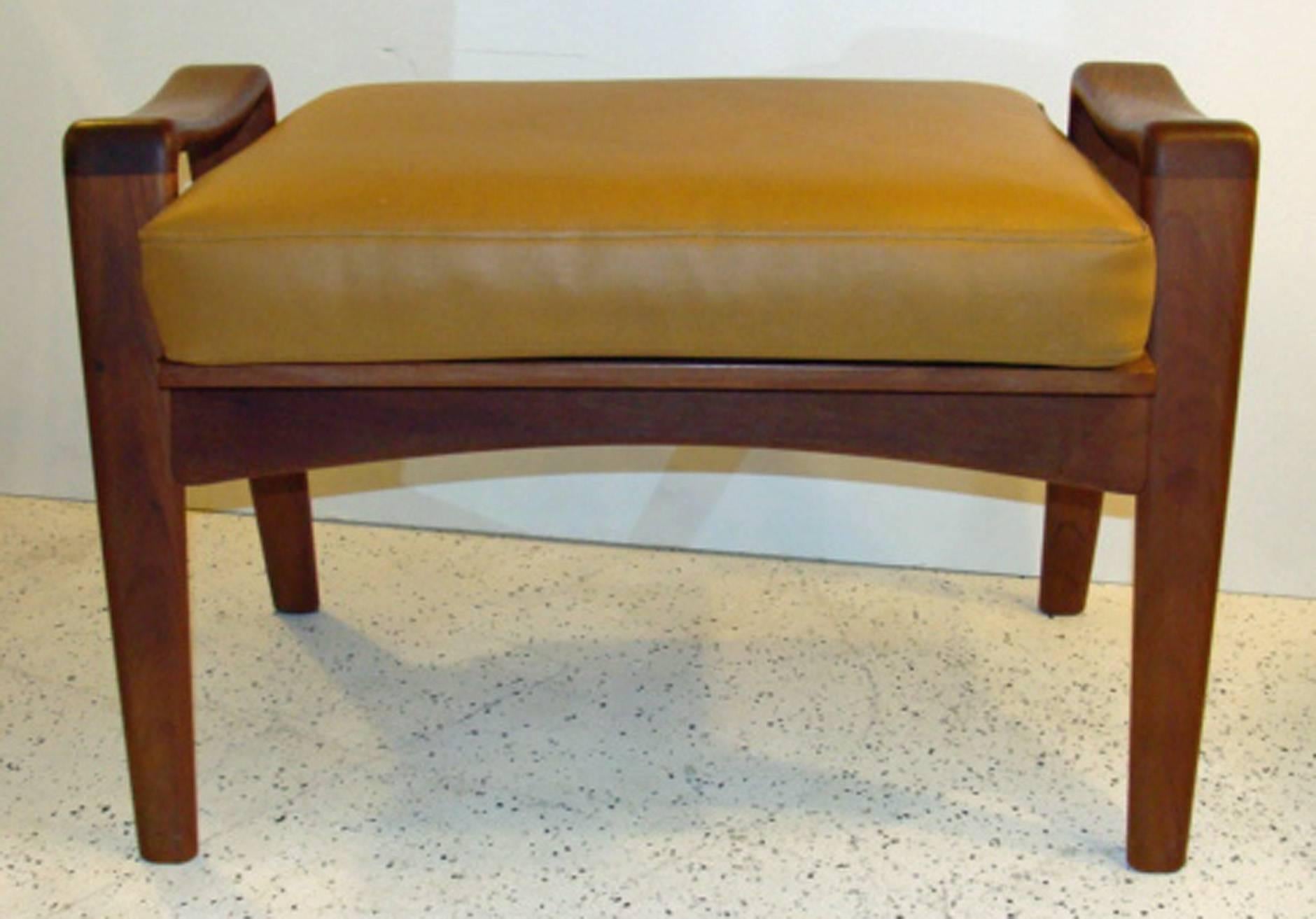 Rare pair of Mid-Century ottomans or footstools in teakwood. Designed by Arne Wahl Iversen for Komfort, Denmark. Retains original cushions and Fagas
straps. Priced individually at $850 each.