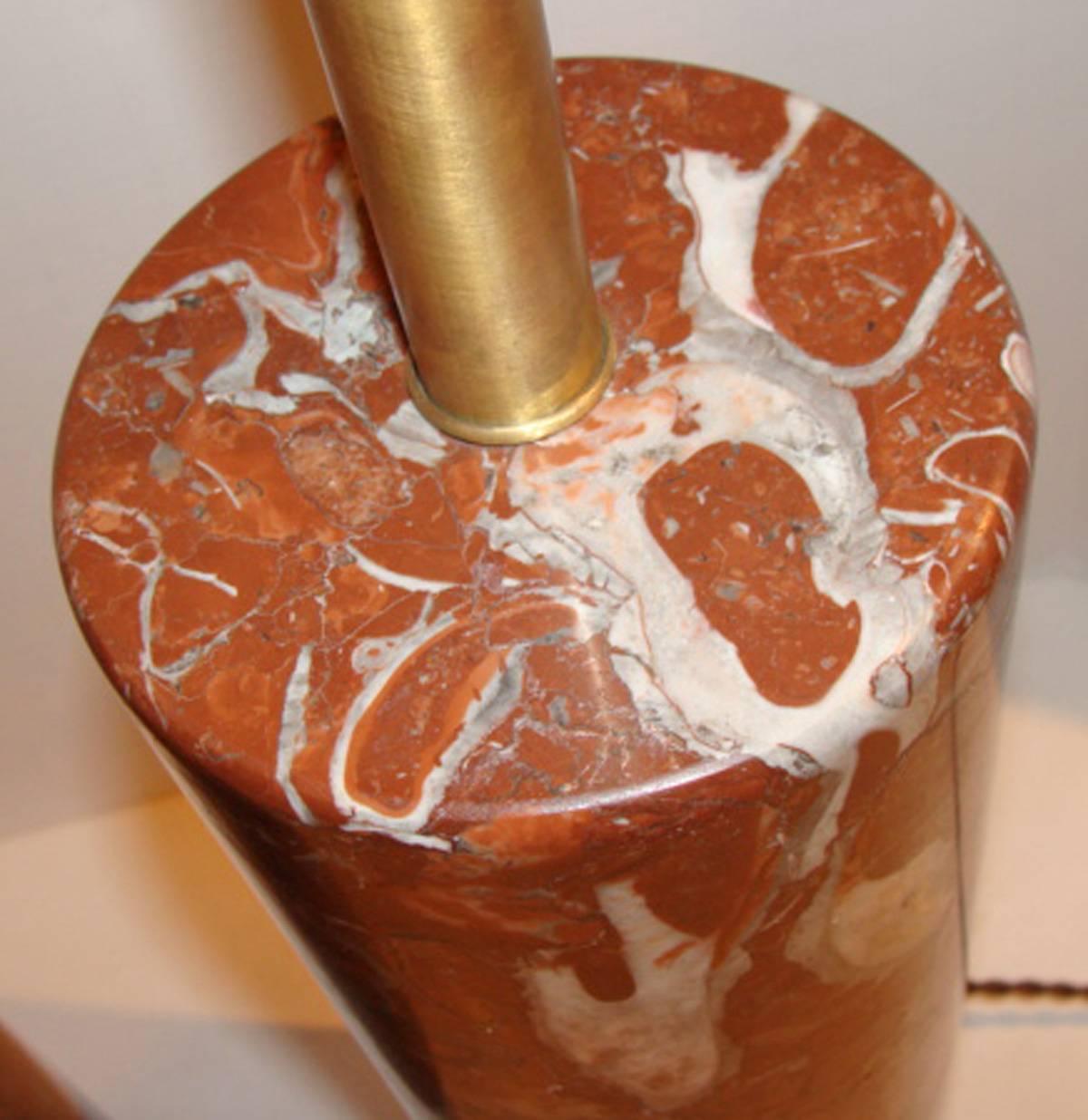 Pair of Nessen cylindrical table lamps in outstanding warm brown variegated marble. Overall gentle wear on metal surfaces and one very small chip on bottom edge of one lamp (see photo).