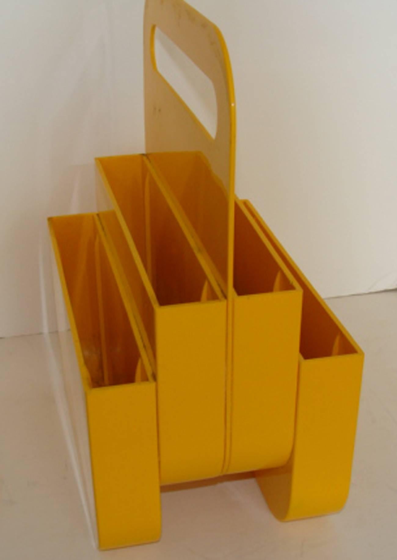 Rarely available, this is a bright yellow ABS plastic magazine holder designed by Olaf von Bohr for Kartell, Italy. No damage or flaws except for a few minor scratches.