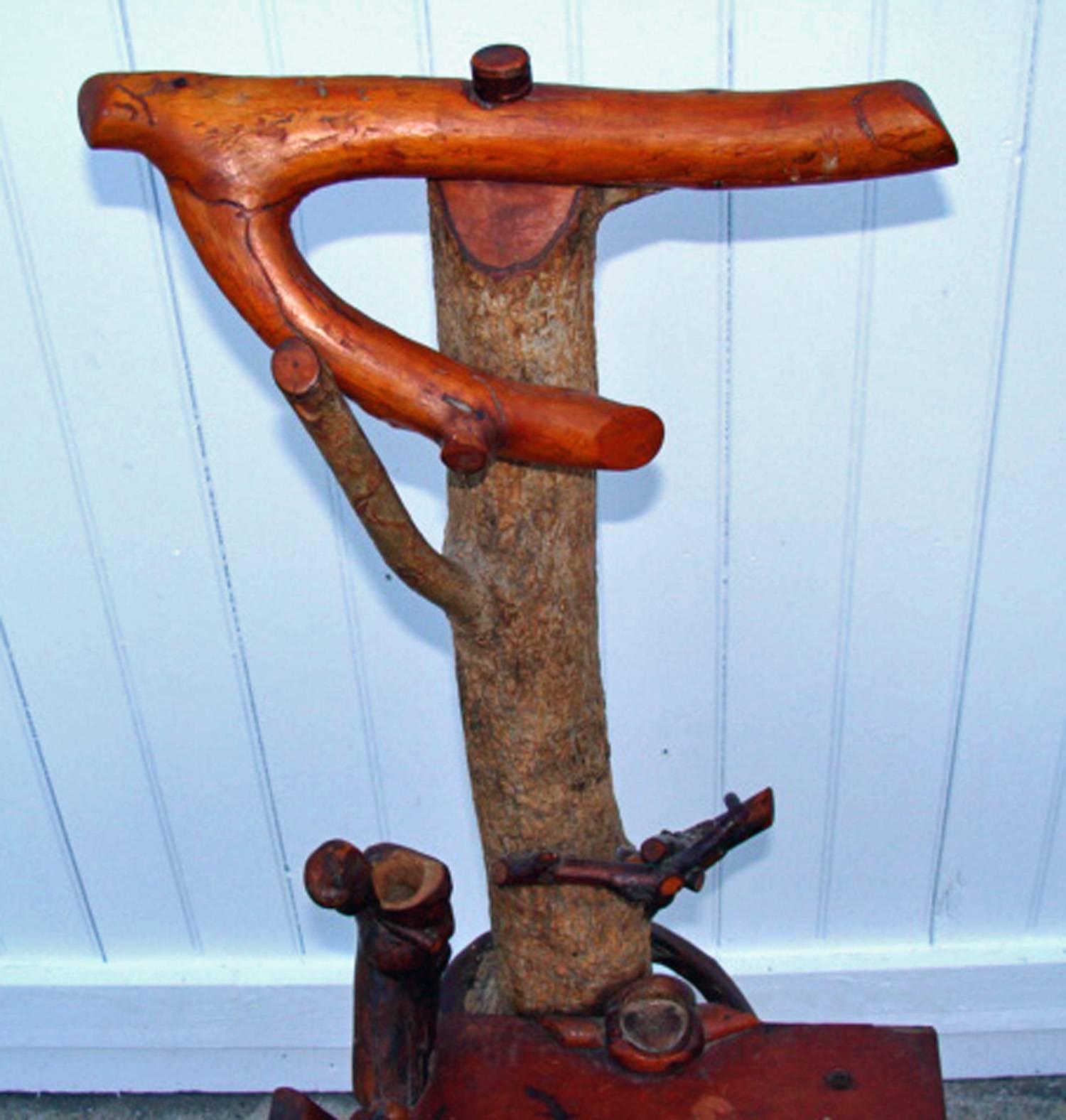 Wonderful expressive stand usable as a valet stand or drink stand or side table. Originally crafted in the early 20th century.

Wood limbs with traces of old paint. Has nice antique patina overall.