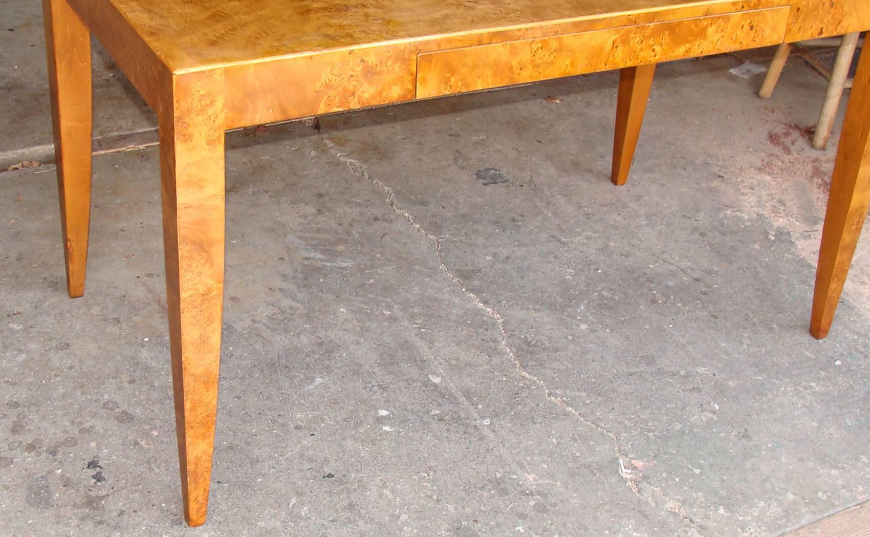 Very chic one drawer writing table or desk in olive burl wood. Also suitable as a small dining table. Marked 
