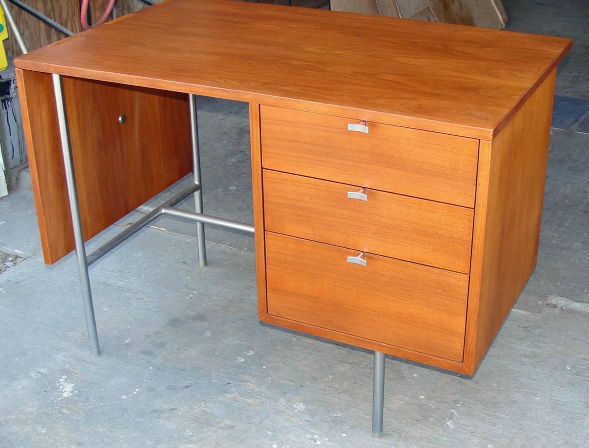 One of Nelson's most engaging designs for Herman Miller, originating in 1947
and lasting well into the 1950s. Small-scale desk in Excellent condition.

Nicely figured walnut with satin chrome 