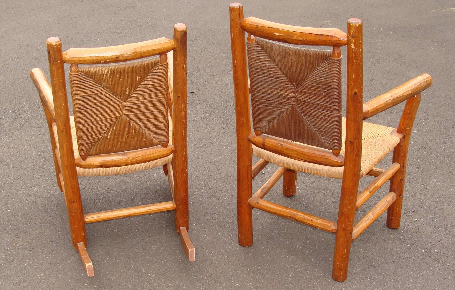 Wonderful rustic or Adirondack style rocker and matching armchair in cedar with rush seats and backs.
Amazing comfort. Honey colored finish blends integrates with modern or traditional decor. Rush seats were likely re-done about 15-20 years ago.