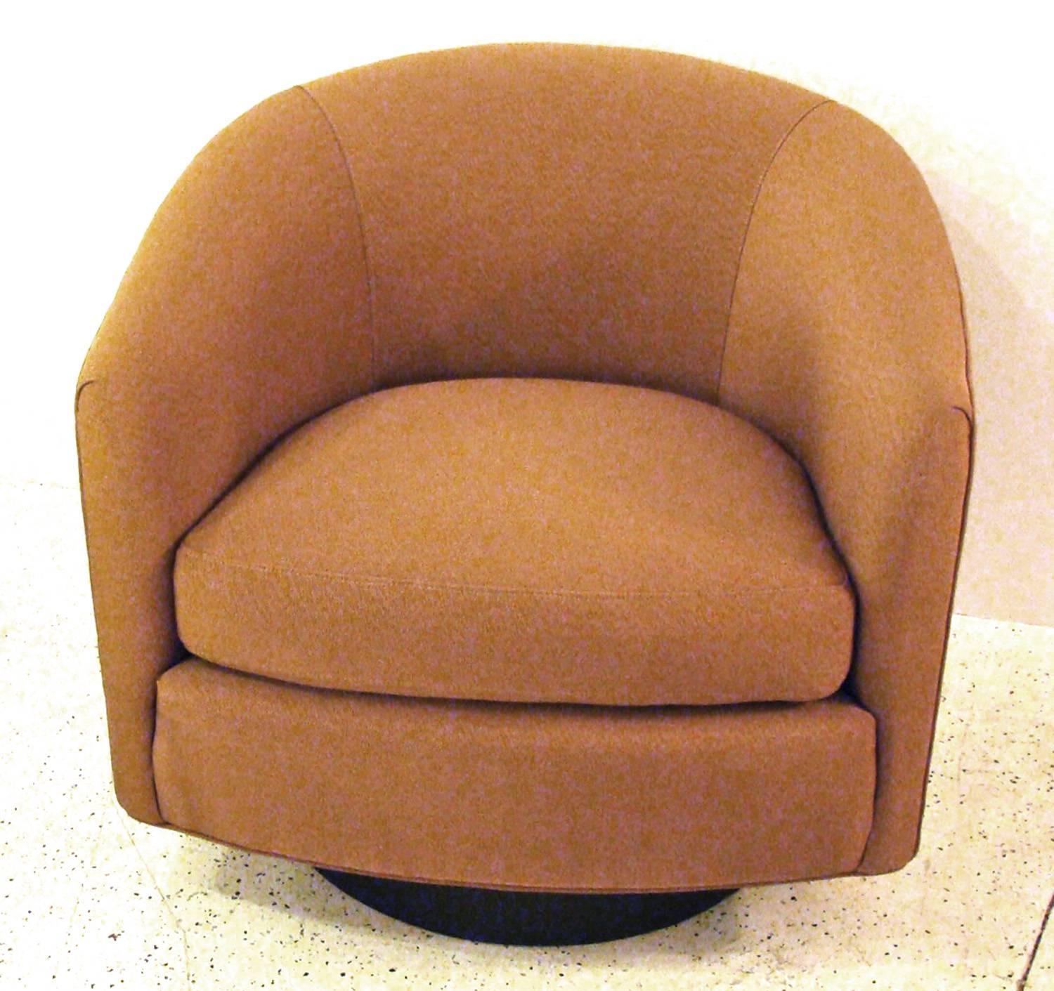 Newly renovated pair of Classic swivel chairs. Now in a durable, tightly woven 