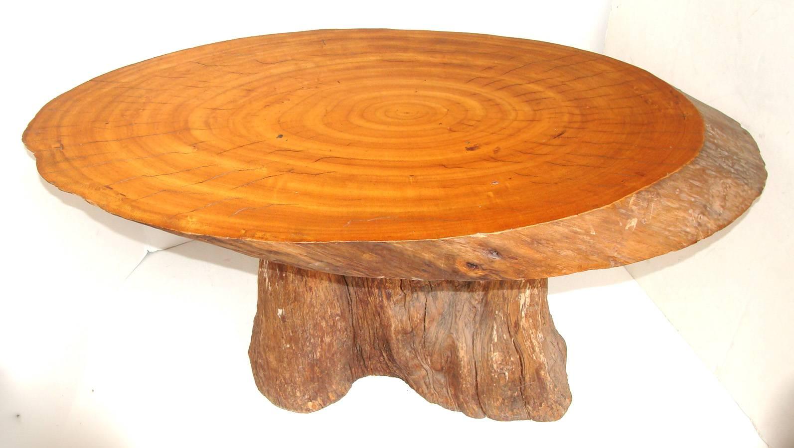 Charming vintage coffee table or side table. Slab top exhibits beautiful grain and patina. Mounted on a driftwood base. Perfect anywhere--be it beach house, mountain cabin, or urban loft.