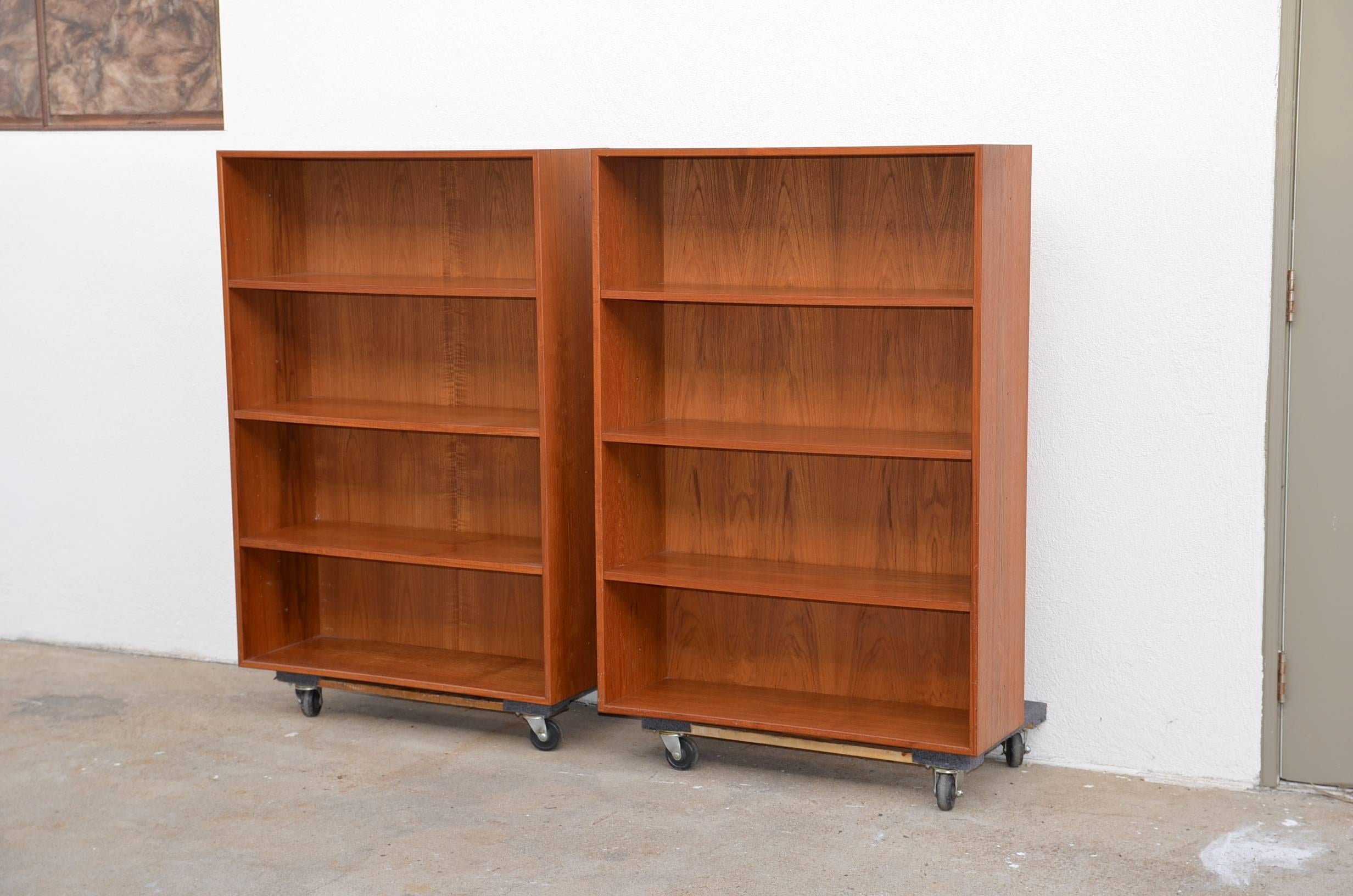 Pair of minimalistic hanging Danish teak shelving units by Dyrlund. Back brackets need to be added for wall mounting.