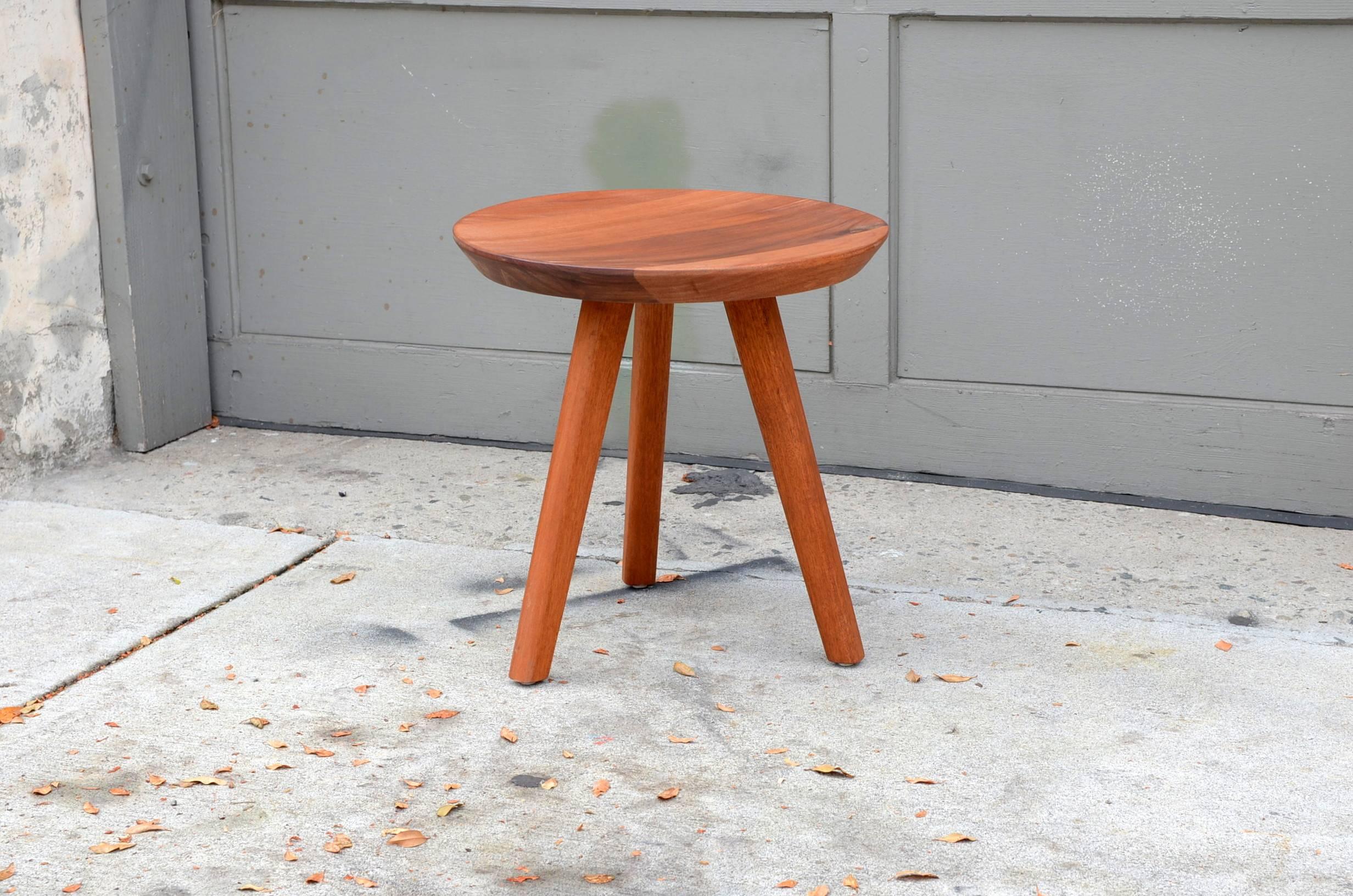 Pair of sturdy tripod carved wood stools in the style of Charlotte Perriand.