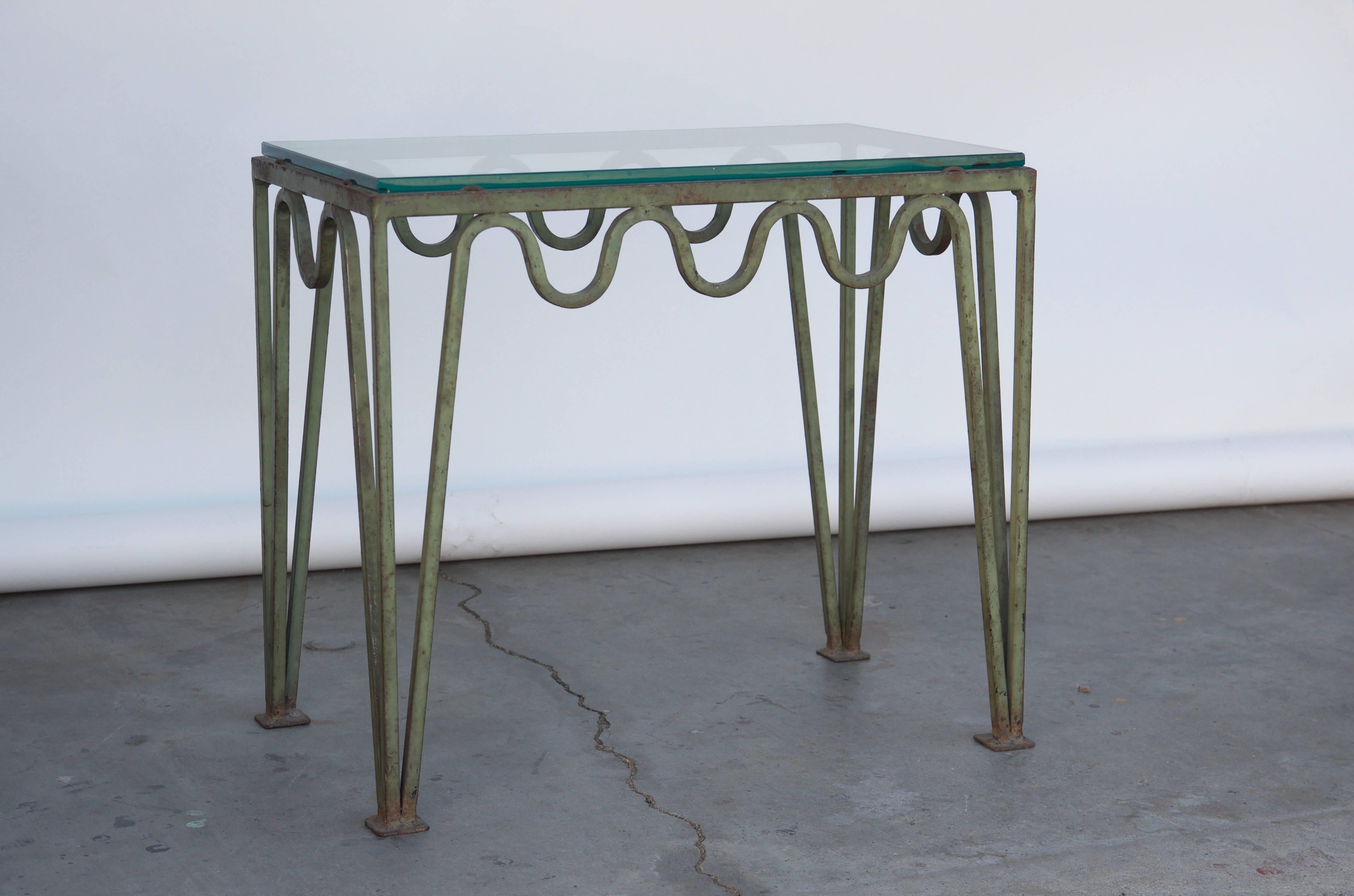 Undulating Verdigris iron and glass side table attributed to Carl Hörvik.