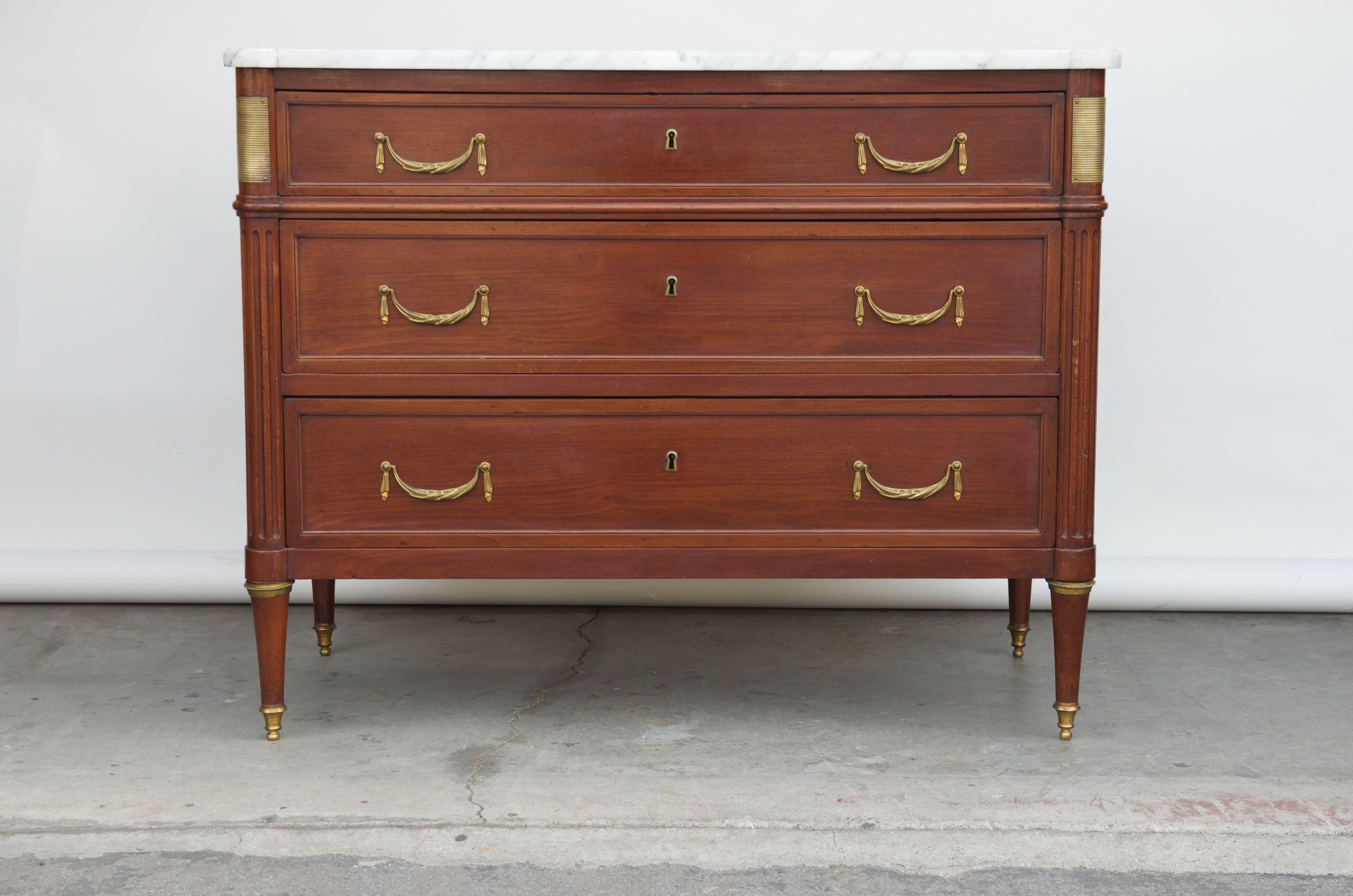 Chic Louis XVI style neoclassical commode by Maison Jansen. Elegant and simple.

The last picture gives an example of how this commode could look in situ.