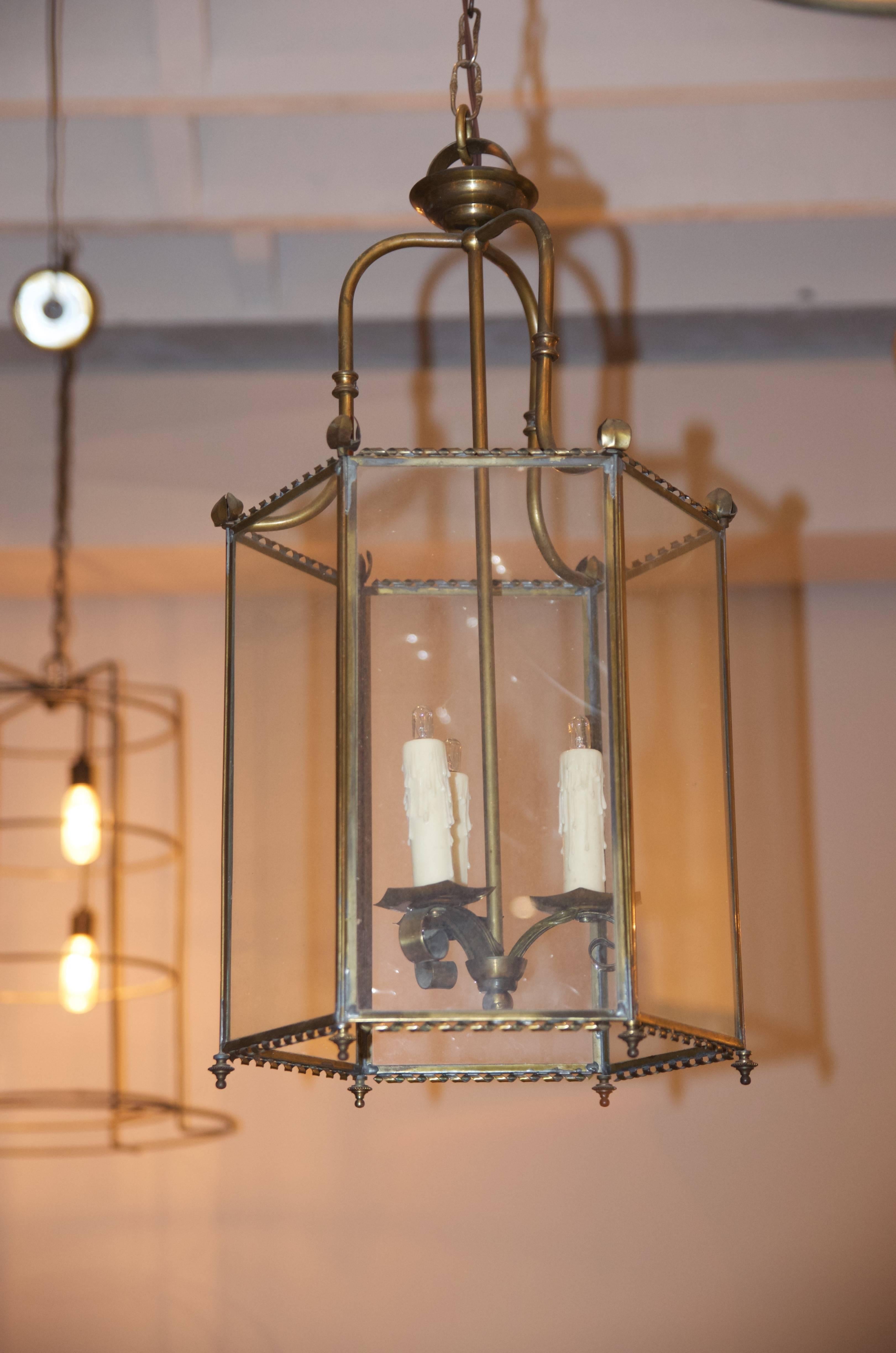 Chic French 1940s brass hexagonal lantern. Professionally rewired, with matching canopies. Chain length can be adjusted.