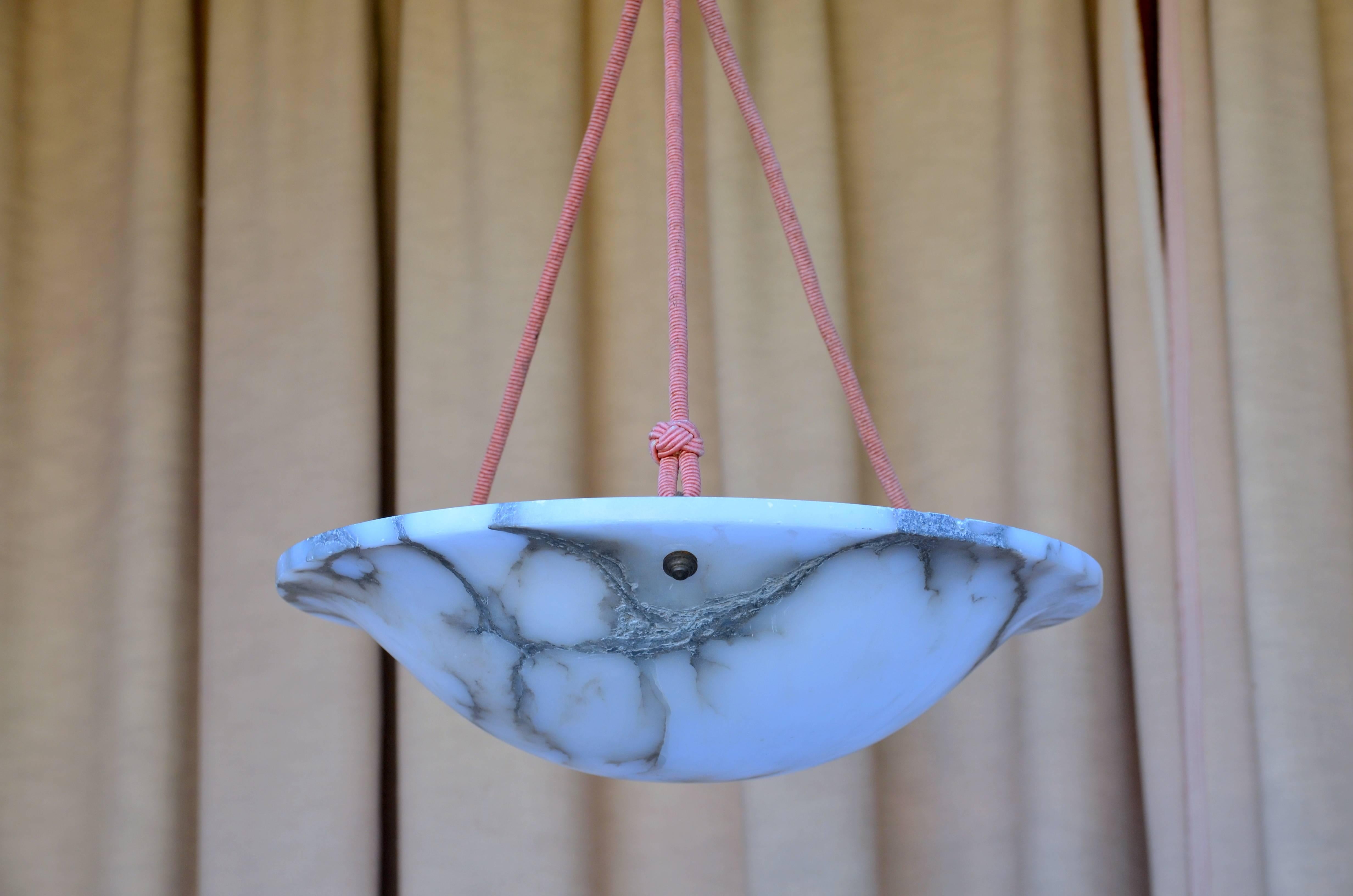Chic Carved French Art Deco Alabaster Hanging Light. Matching alabaster canopy. Great for a hallway or a bedroom. Emits a beautiful soft light.