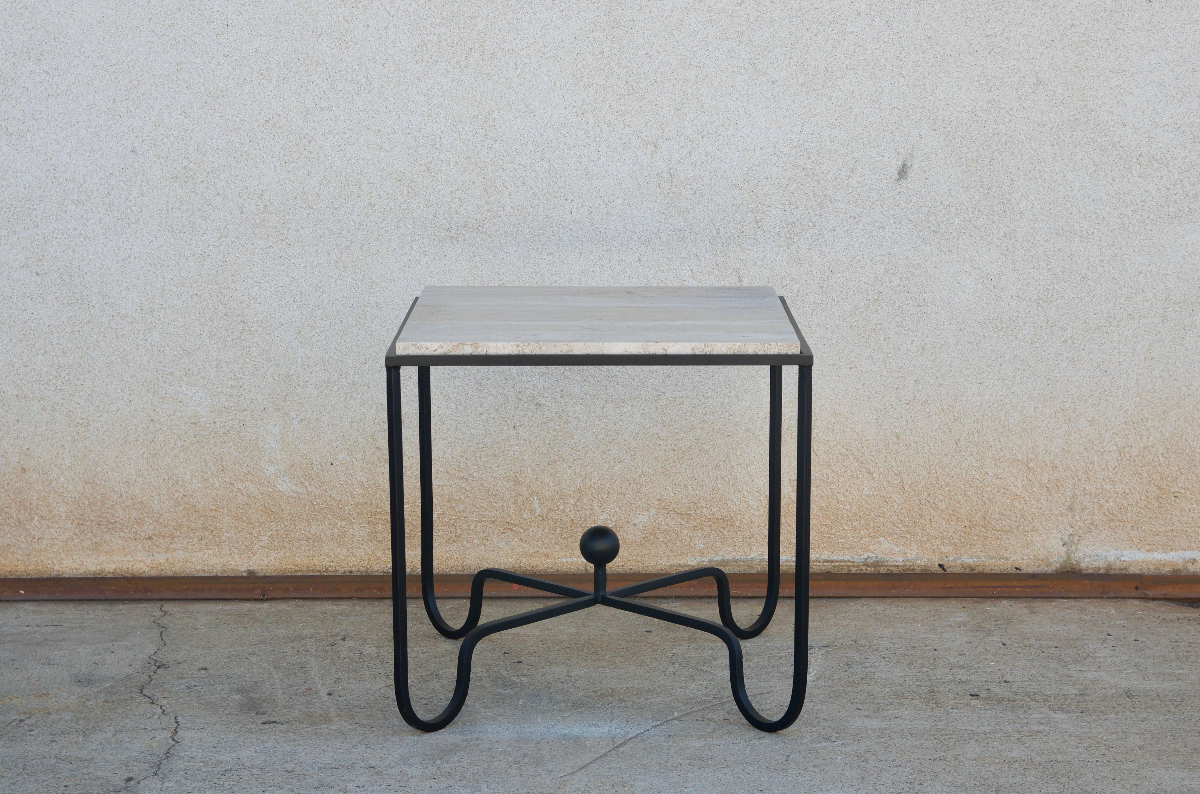 Pair of entretoise travertine tables in the style of Mathieu Matégot.