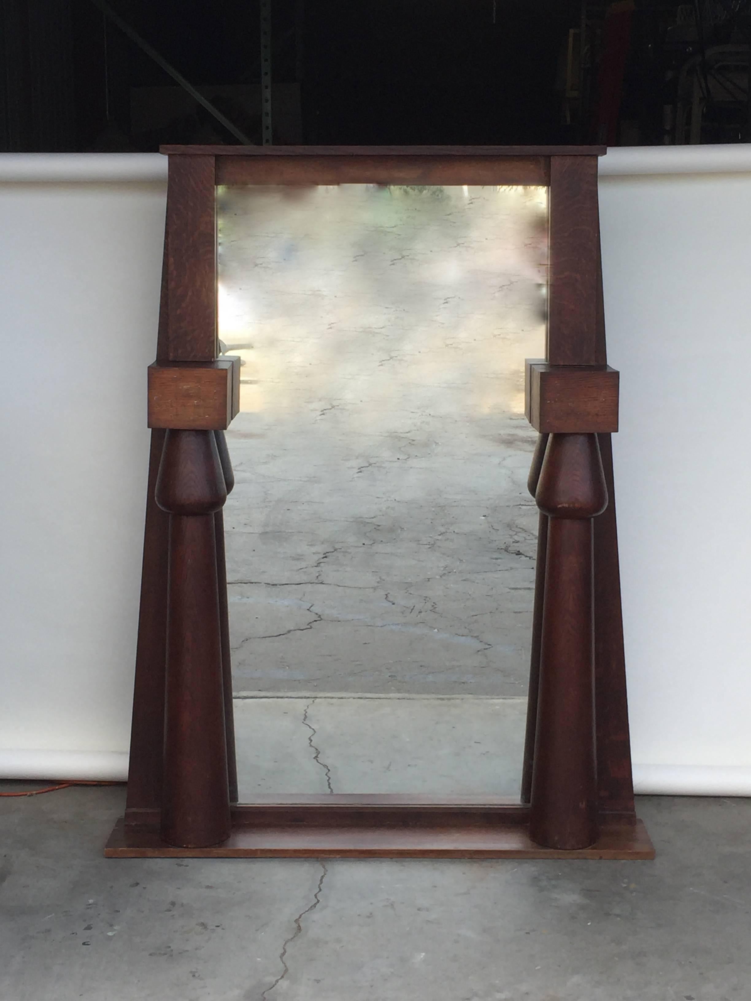 Impressive Egyptian Revival Arts & Crafts stained oak mirror. Perfect over a fireplace.