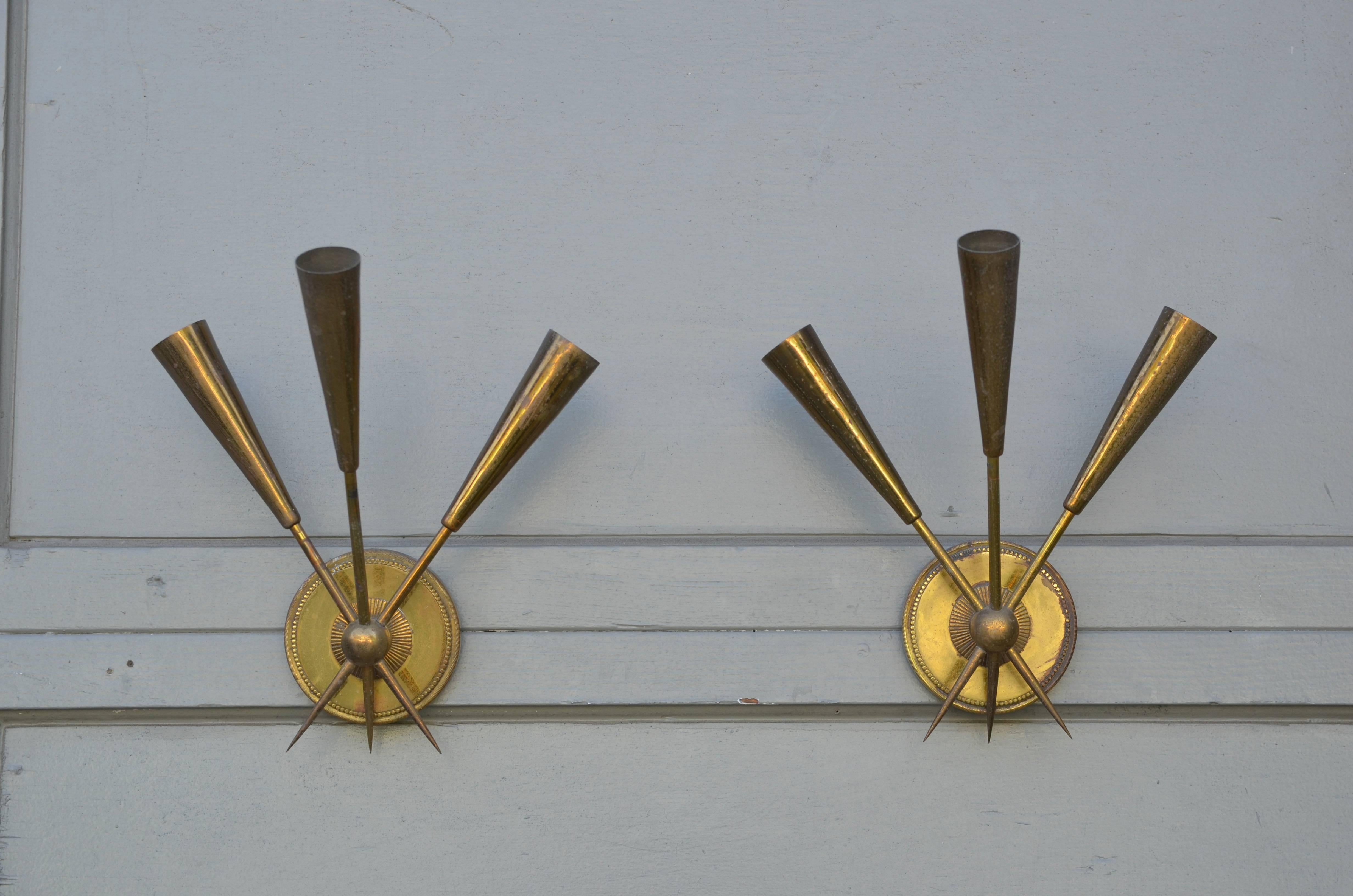 Pair of chic French, 1950s three-arm patinated brass sconces.