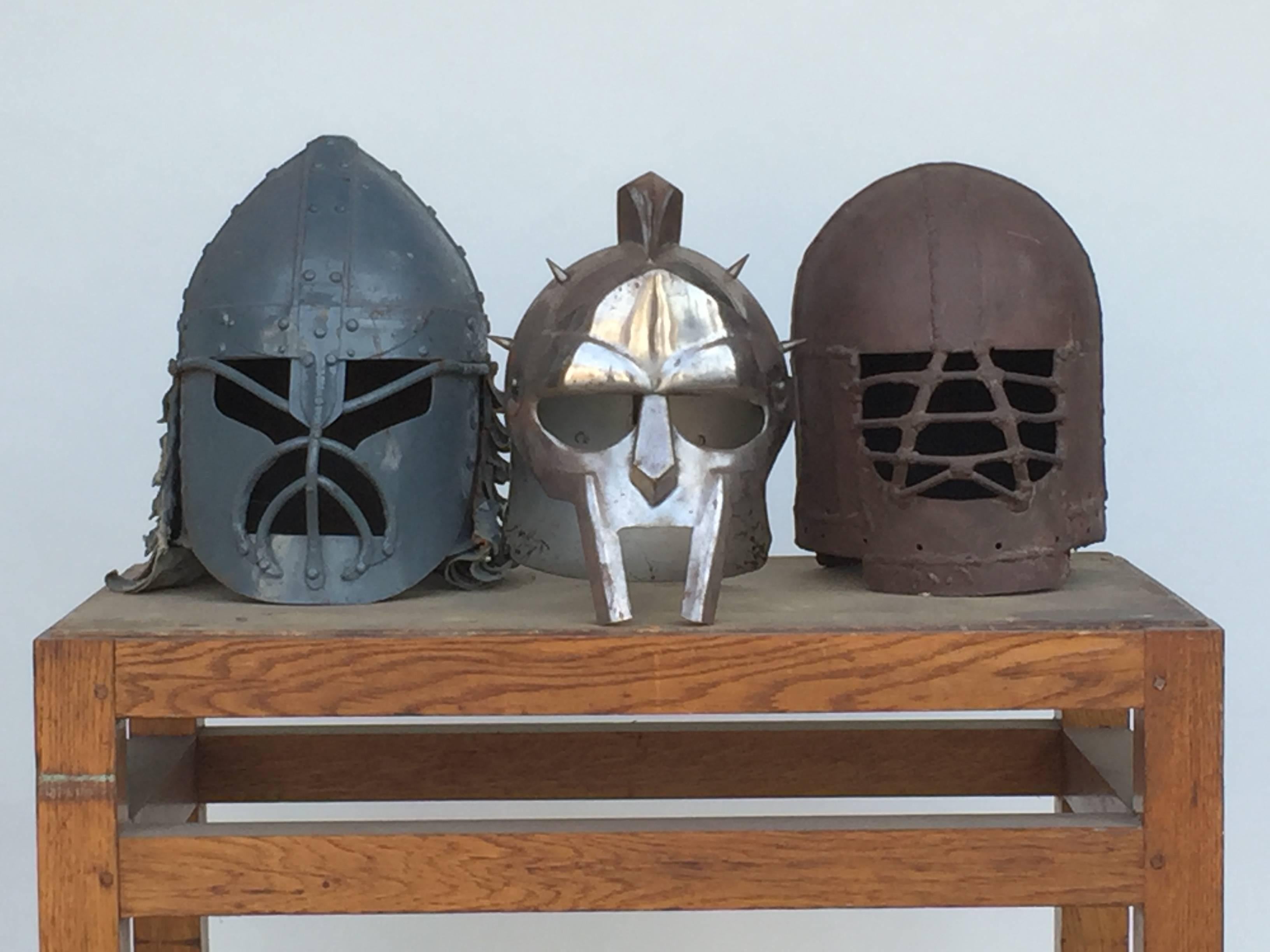 Decorative collection of three movie prop masks. Measuring largest mask is 13 in. tall x 12 in. diameter.