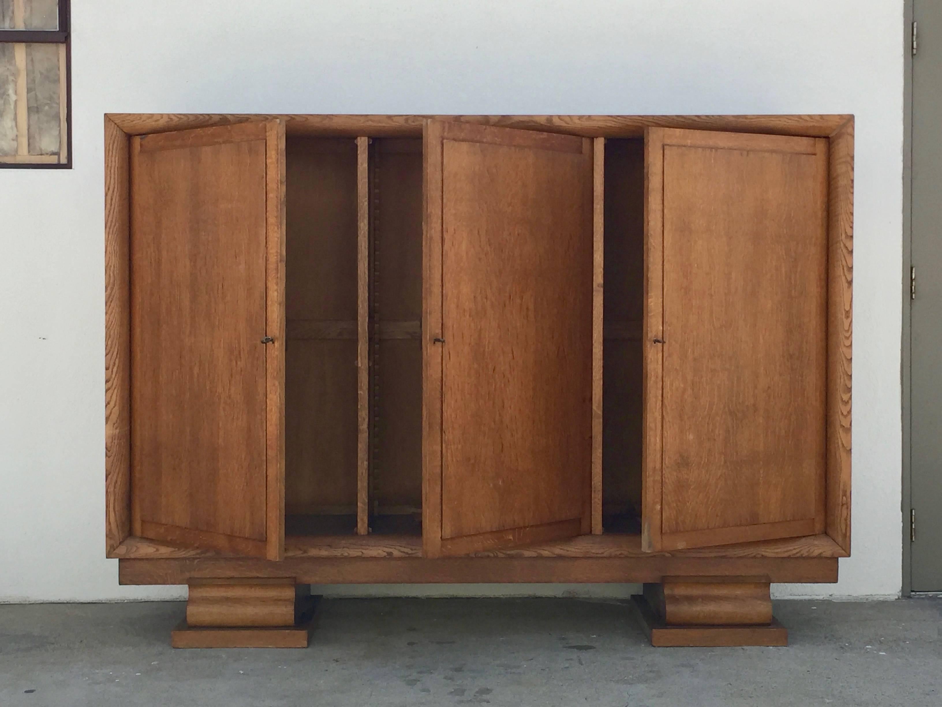 Incredible Polished Oak Low Armoire by Jacques Adnet.

This piece was purchasef at auction in Paris and shipped to our Los Angeles gallery by container.

Jacques Adnet (April 20, 1900 – October 29, 1984) was a French art deco modernist designer,