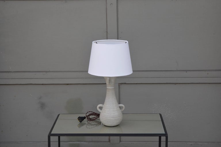 Chic gourd shaped table lamp with custom white parchment shade. The shade itself is 8 in. diameter at top x 10 in. diameter at bottom x 7 in. tall.