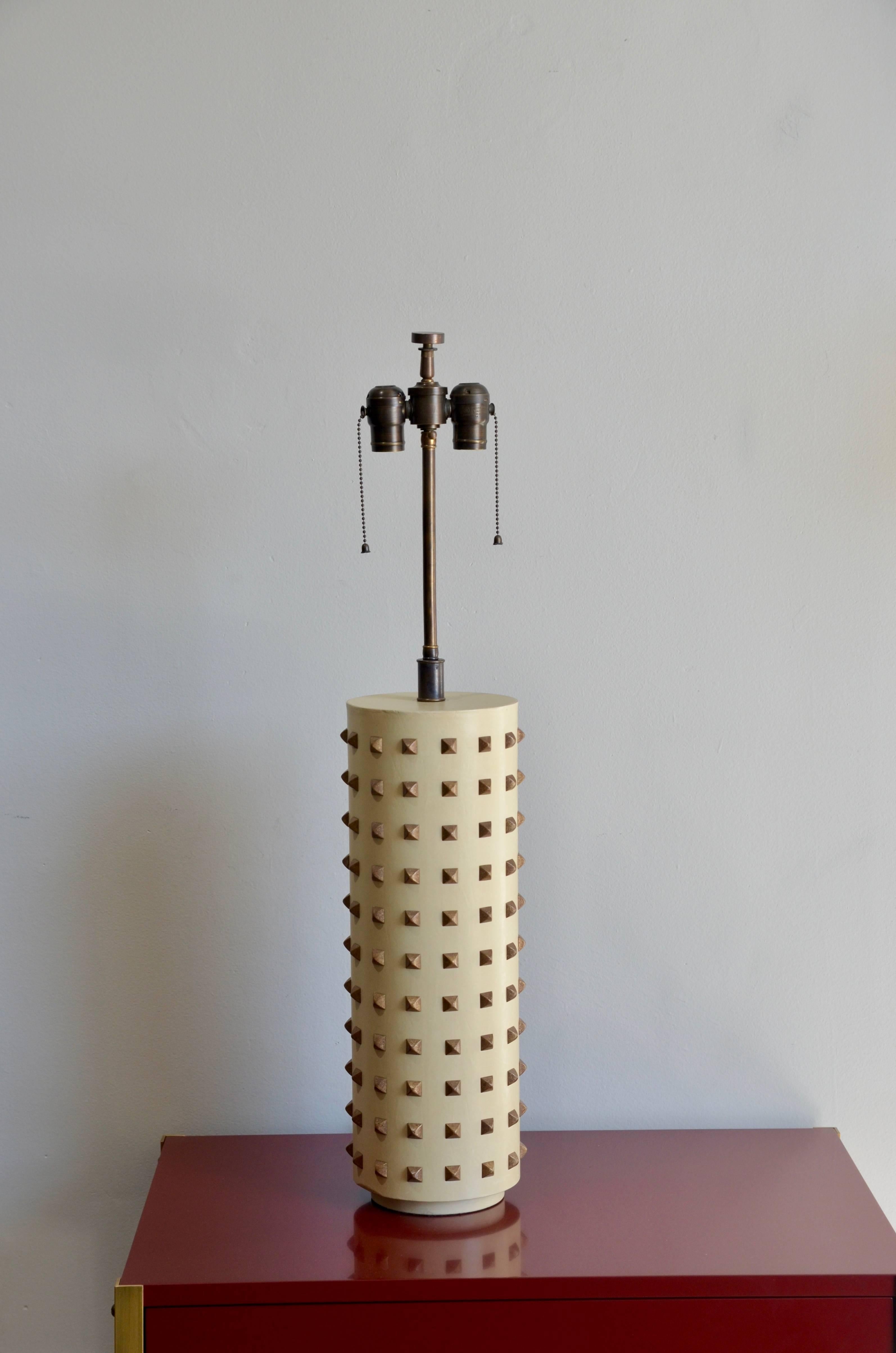 Large studded cylinder table lamp.