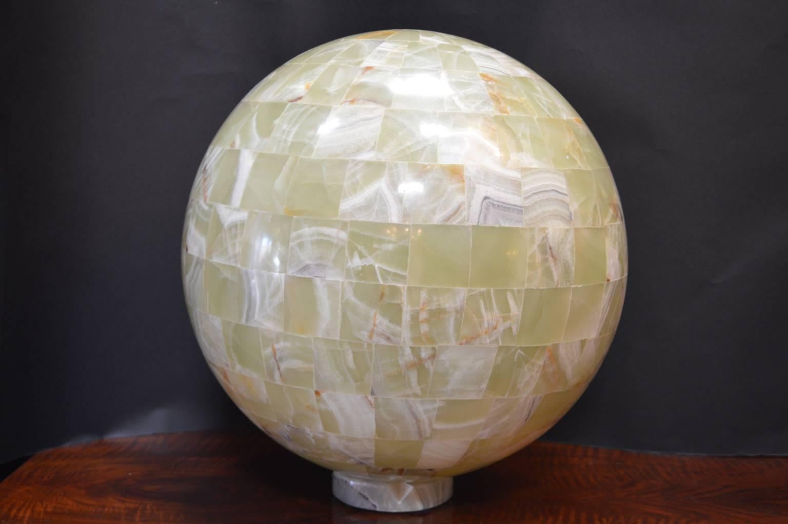 Pair of polished green onyx globe lights.