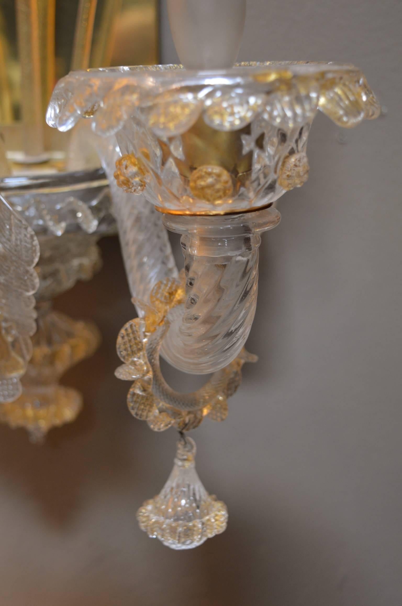 Pair of Murano glass flower sconces. Glass is infused with gold leafing.