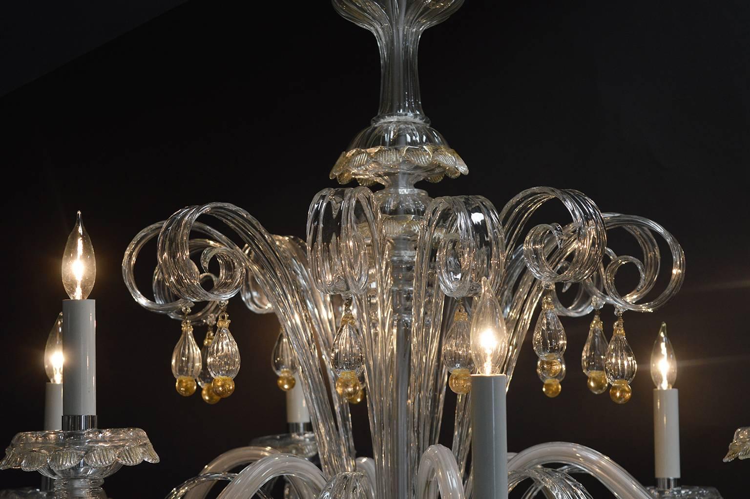 Six-light Murano chandelier. Handblown clear glass with gold flake accents.