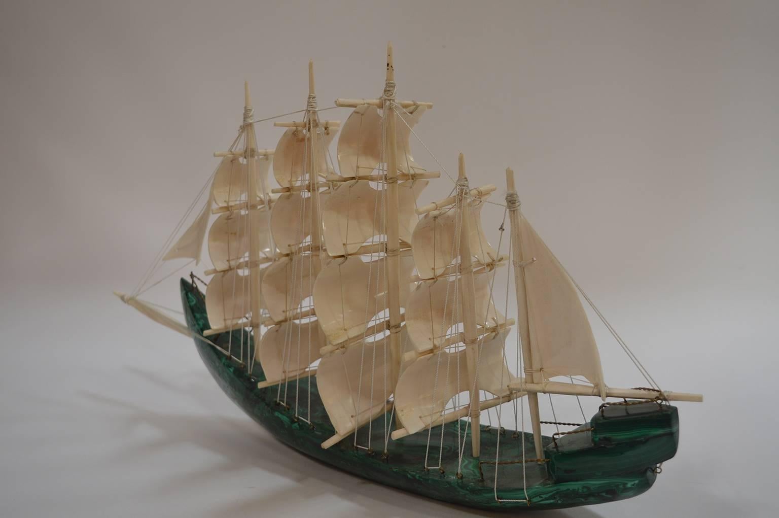 Malachite sail boat with carved bone detail sails.