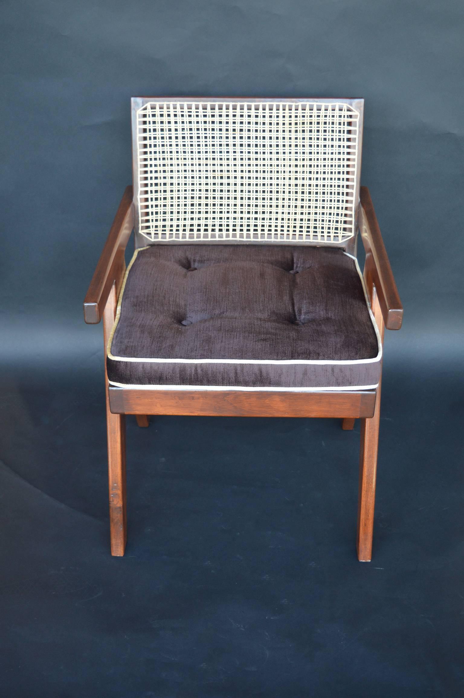 Set of 14 Pierre Jeanneret armchairs.