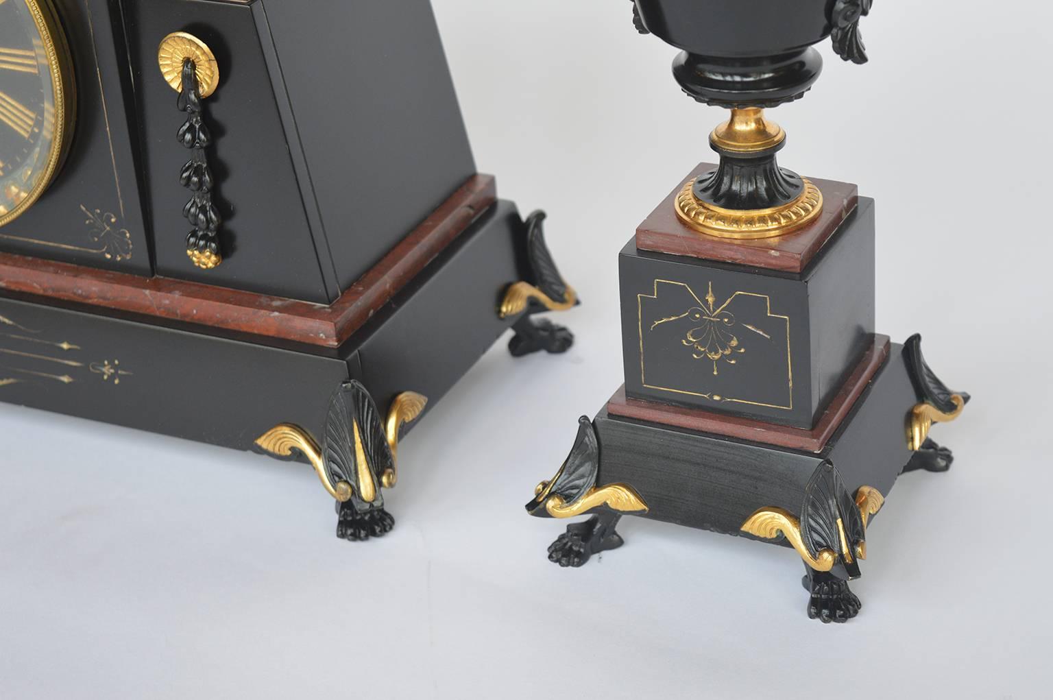 French bronze and marble Egyptian inspired clockset. Bronze with black patina.
Measurements of urns: 13.5