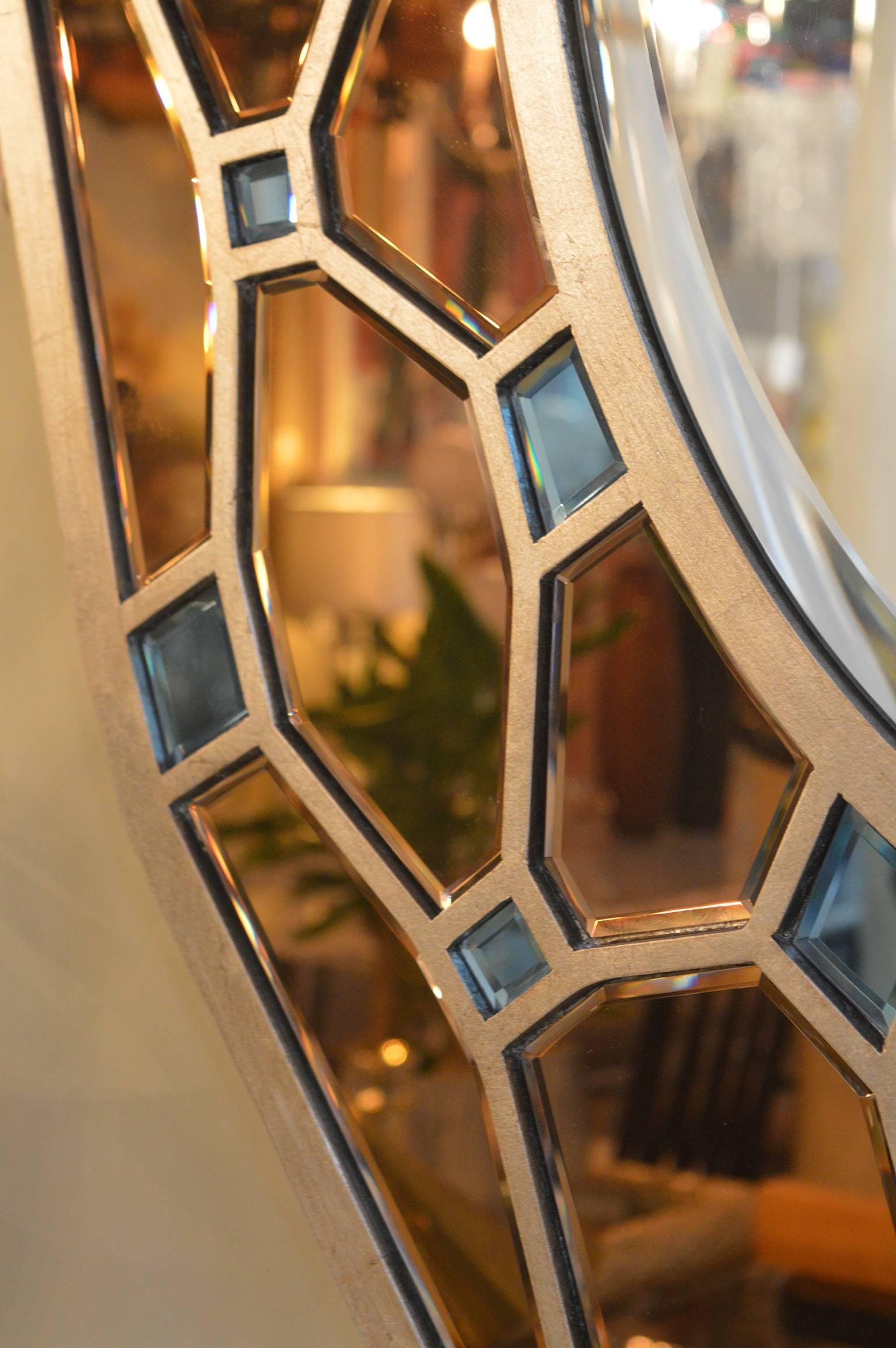 Pair of Hollywood Regency mirrors with copper and blue mirror.
