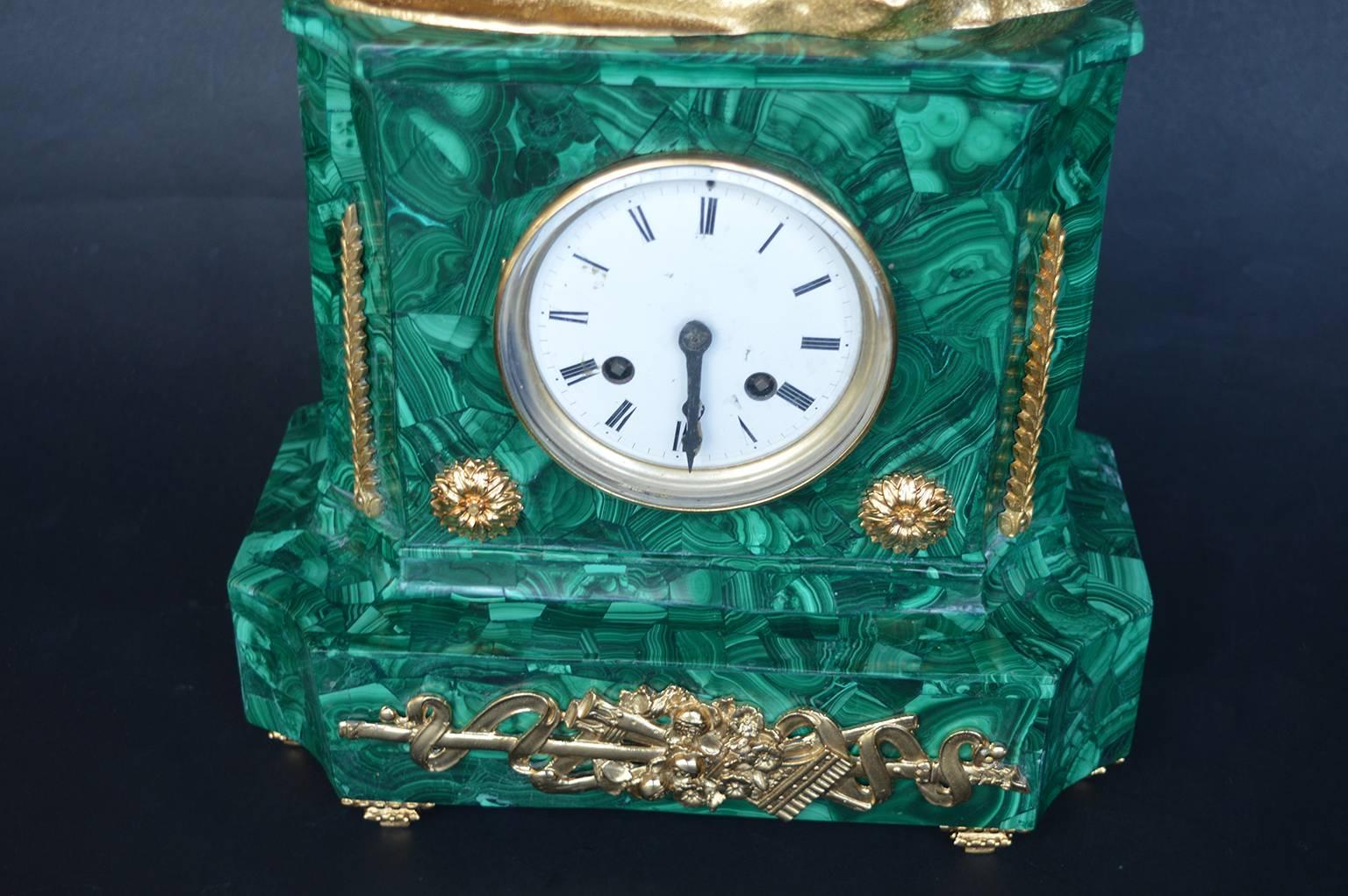 French clock on African malachite. Clock is in working condition.