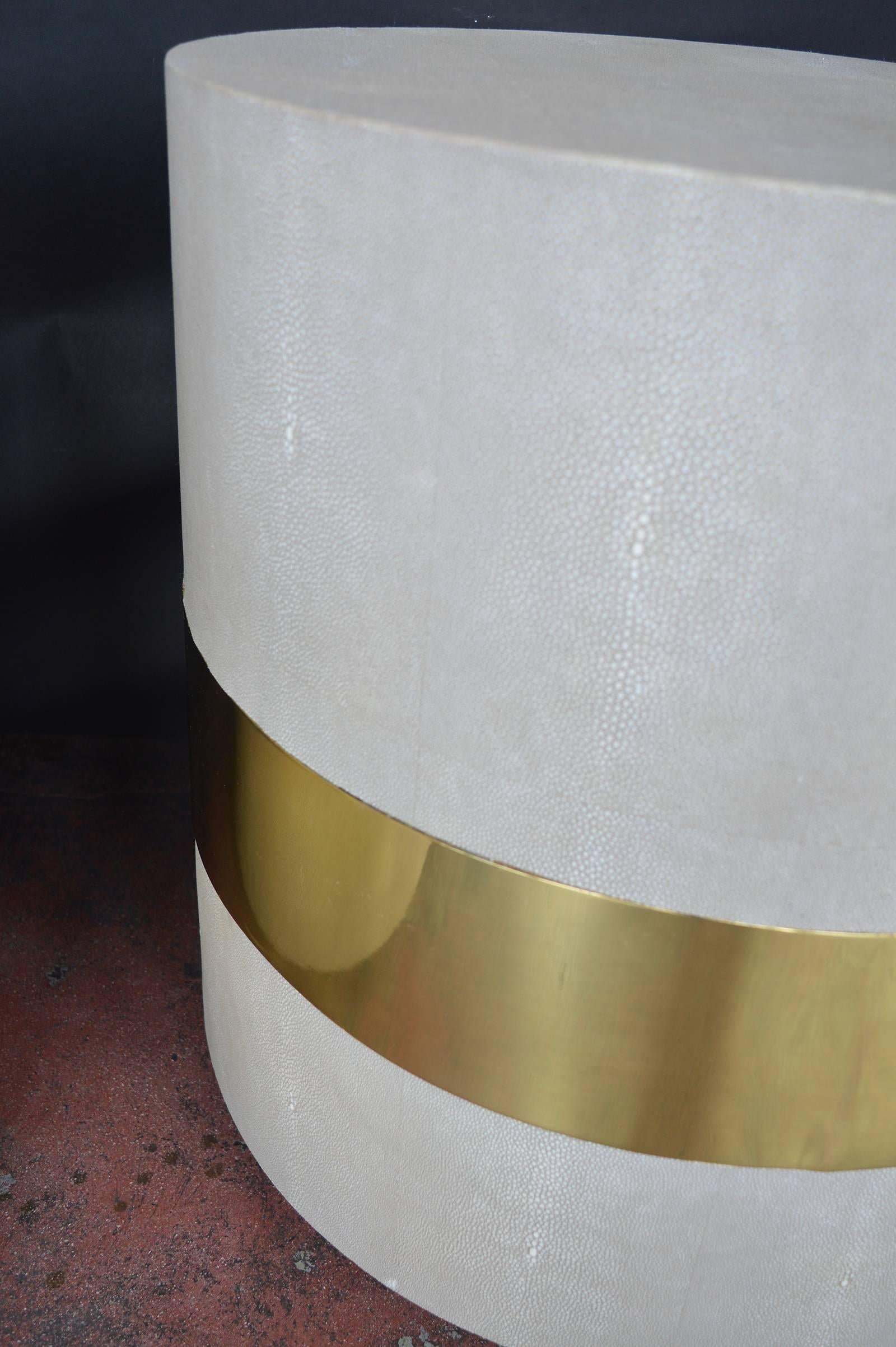 Pair of round shagreen side tables accented with brass.