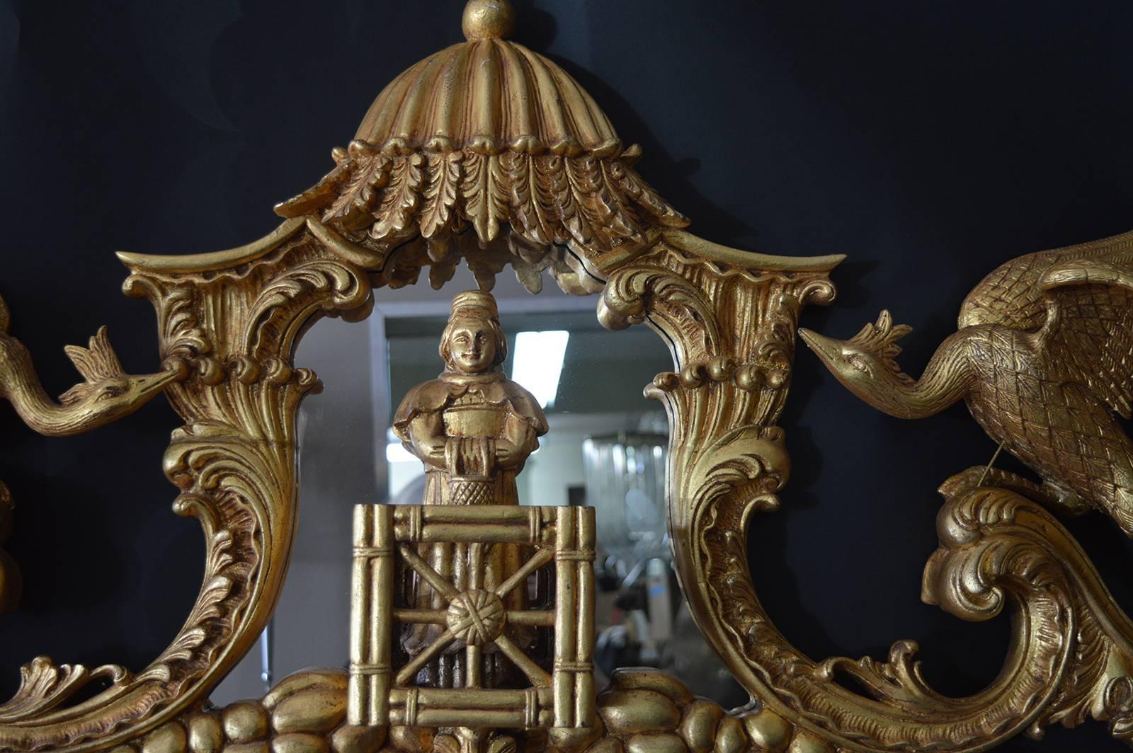 Chinese Chippendale style gold gilt mirror. Pagoda top with Chinese figure, carve phoenix birds on each side and scroll carvings on the sides and bottom.