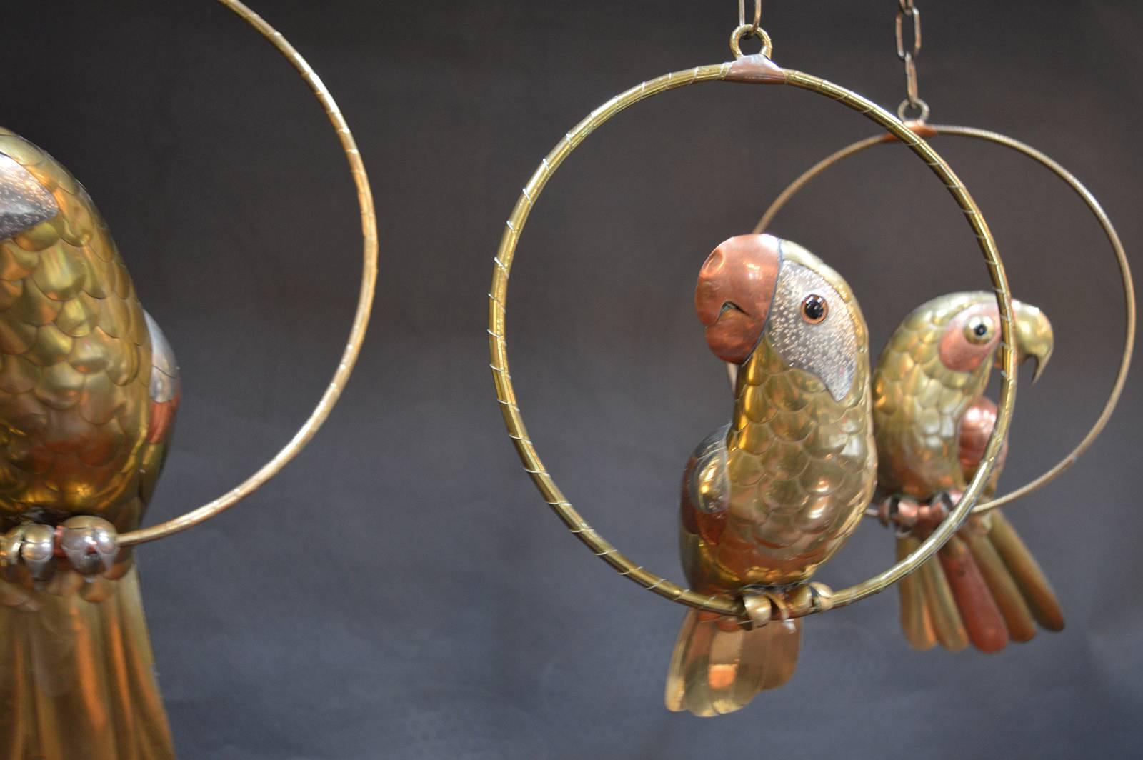 Set of three brass parrot sculptures by Sergio Bustamante. Measurements below are for the largest parrot.

Measures: Middle parrot: 12.5