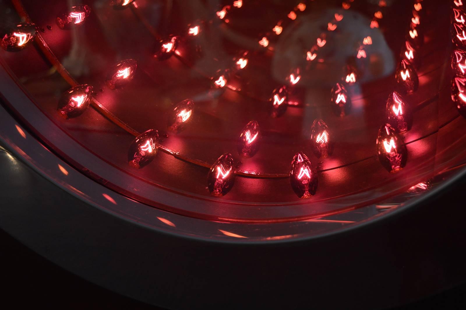 Infinity mirror with red bulbs.