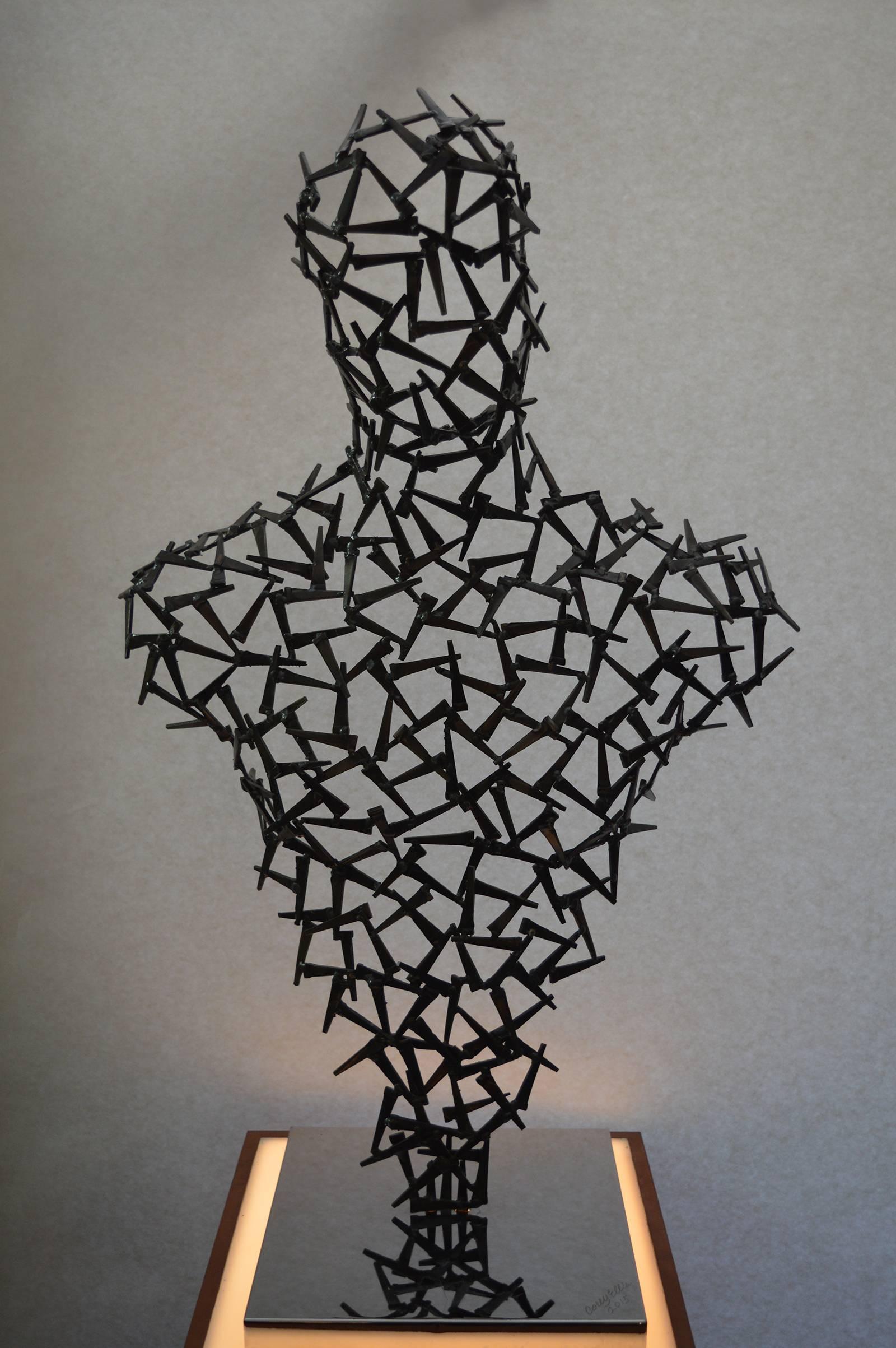 Modern male bust by Corey Ellis. Made from antique square nails. Signed and dated 2015.
Measures: Height on pedestal: 63