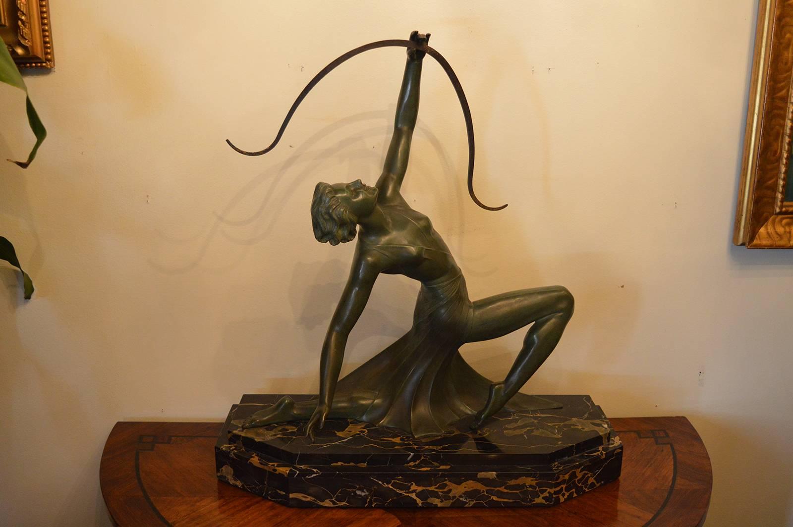 French Art Deco green patinated bronze archer statue.